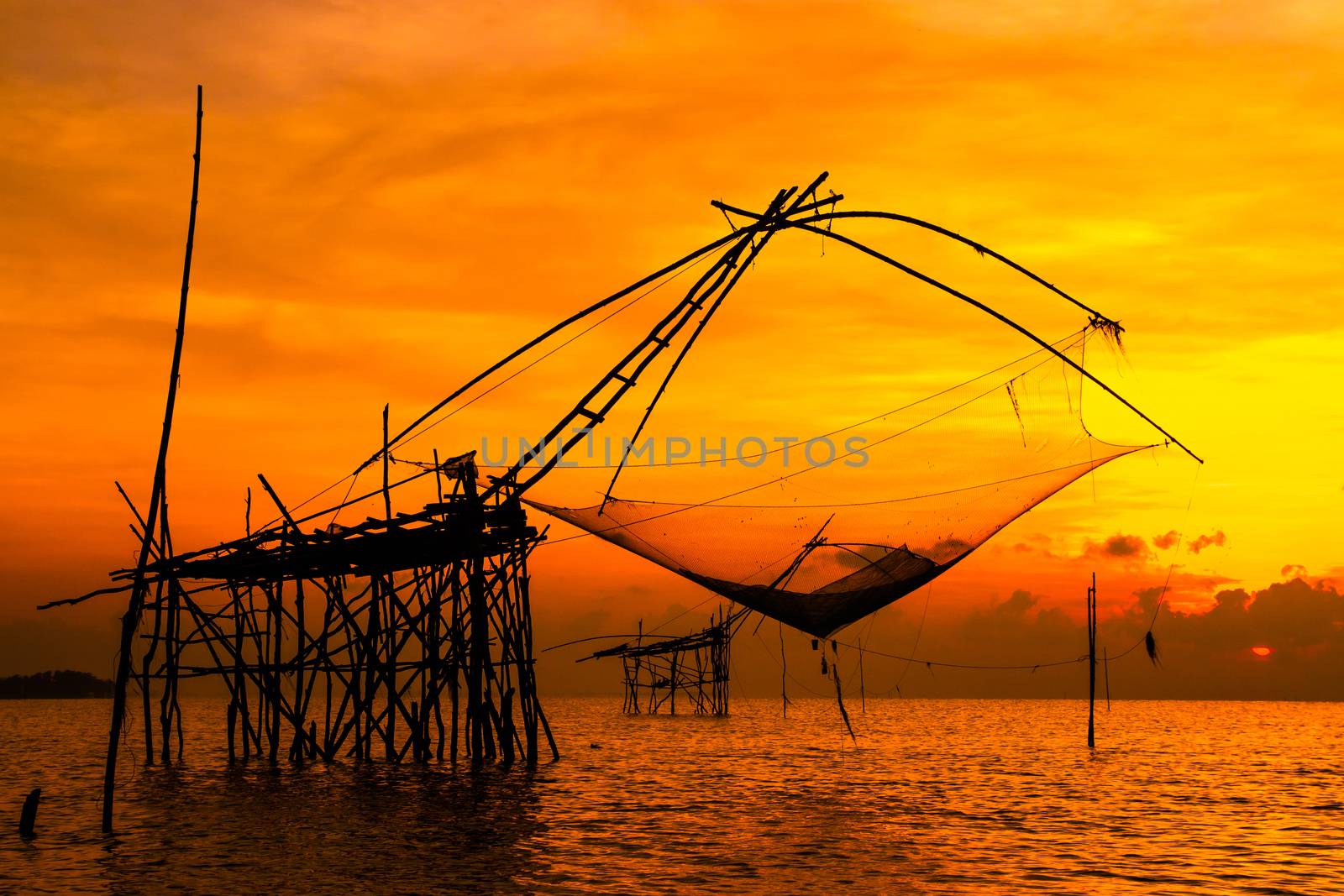 Landscape of square dip net or Yo(Thai language)made of bamboo in morning at Ban Pak Pra -Talay Noi Lake, Phatthalung, Thailand