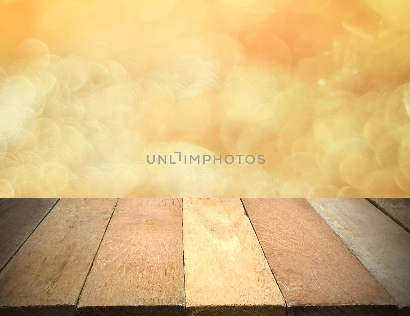Empty wooden table in front of bokeh lights background.
