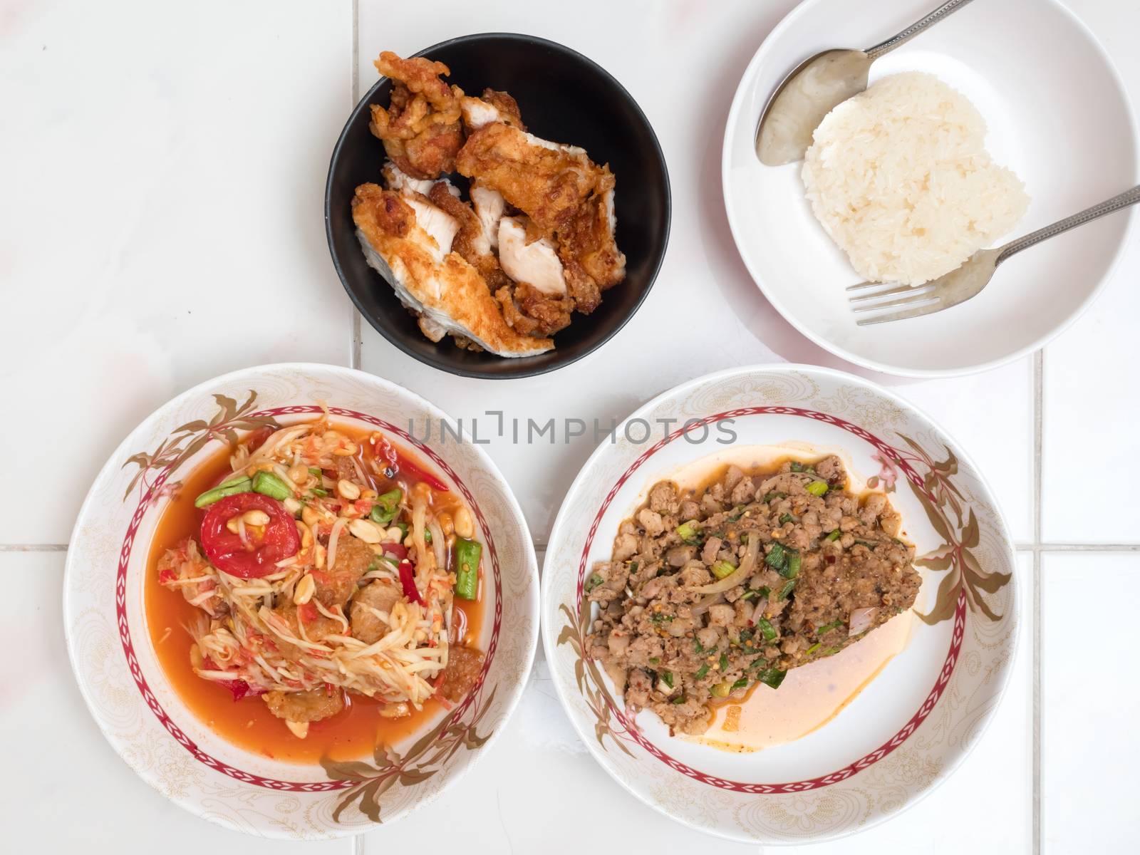 Top view of Papaya salad with Spicy minced pork,Fried chicken and Sticky rice,Thai local food