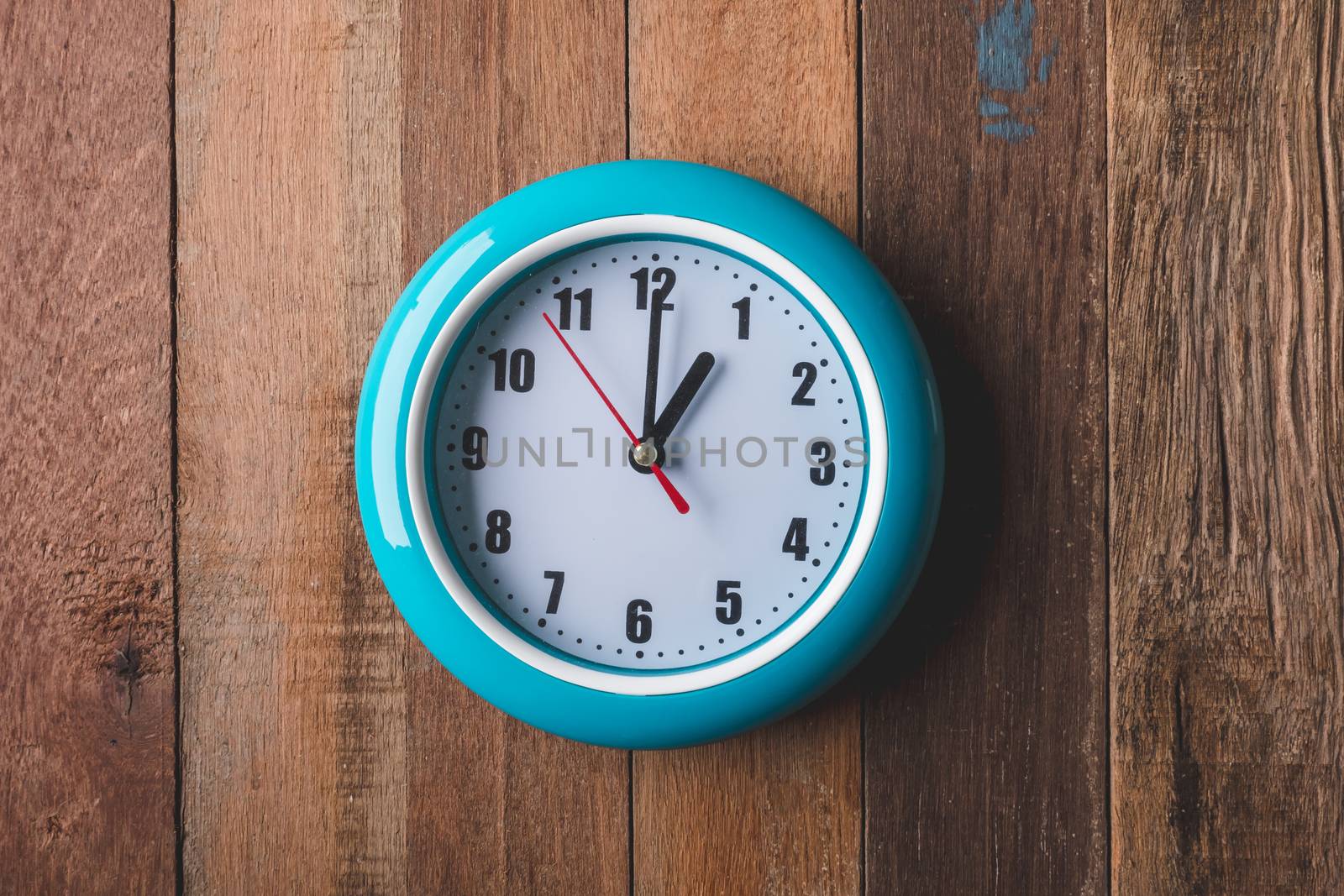 Top view of  Clock on wooden table background.