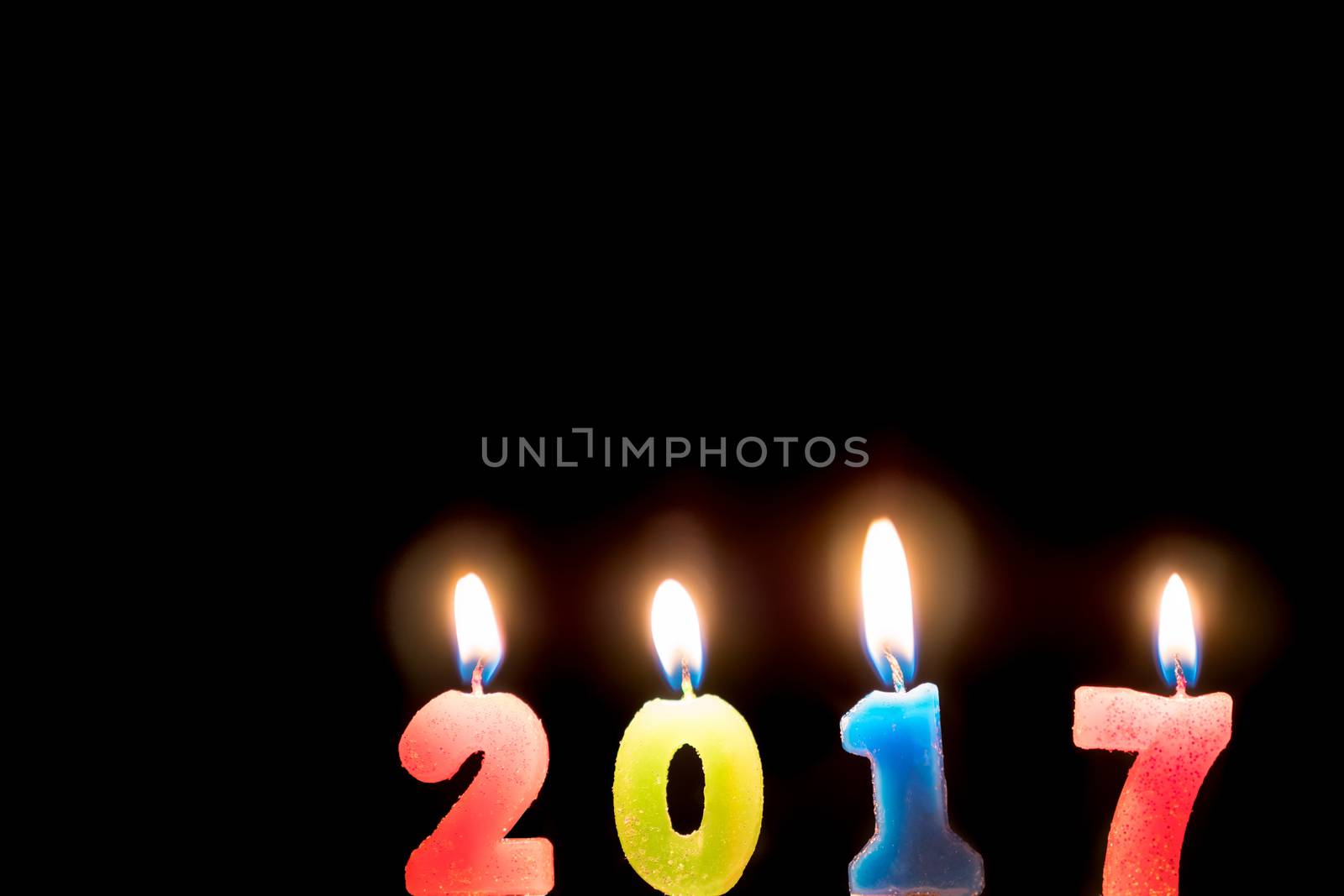 2017 candles numbers on black background. New Year Concept