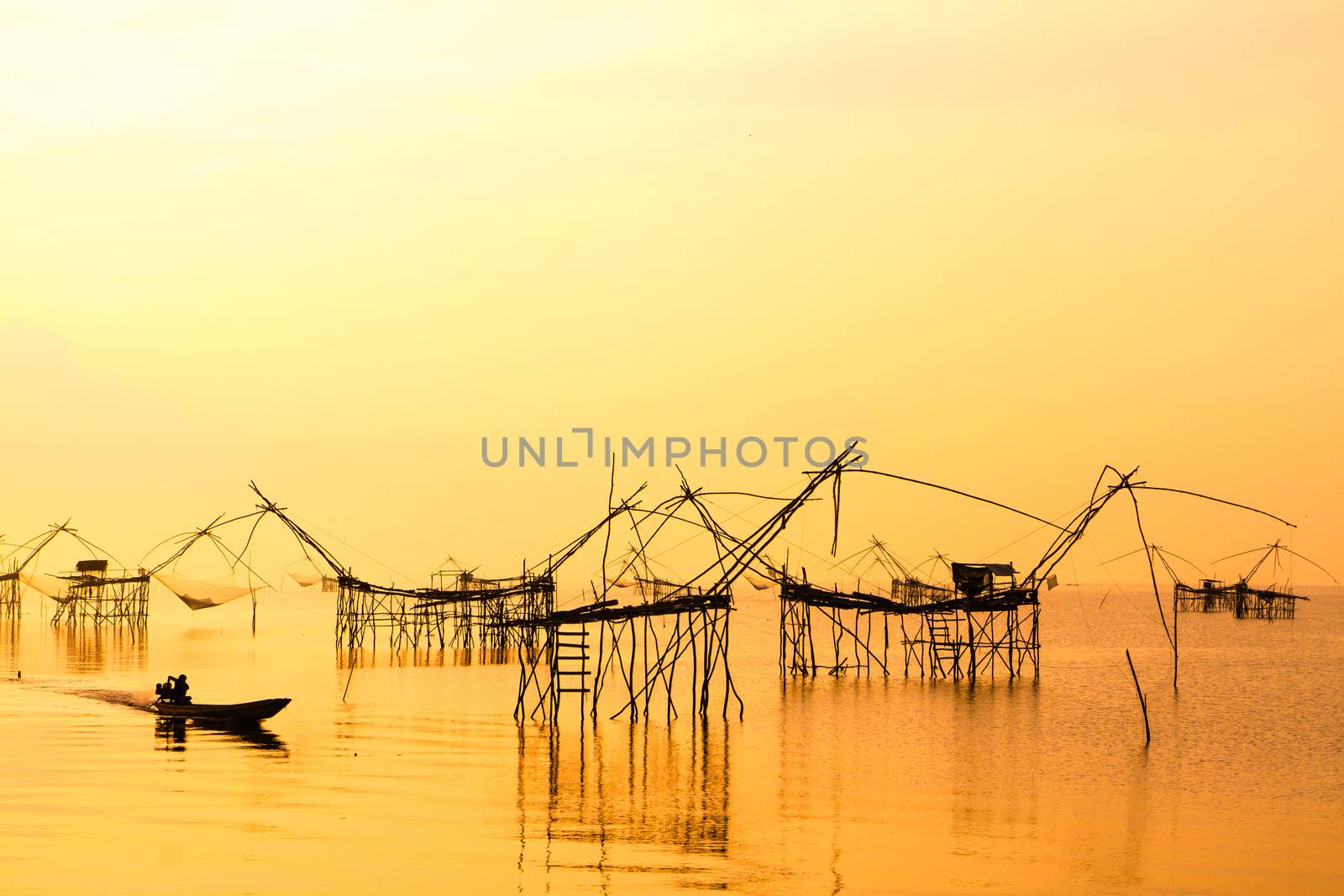 Landscape of square dip net or Yo(Thai language)made of bamboo in morning at Ban Pak Pra -Talay Noi Lake, Phatthalung, Thailand