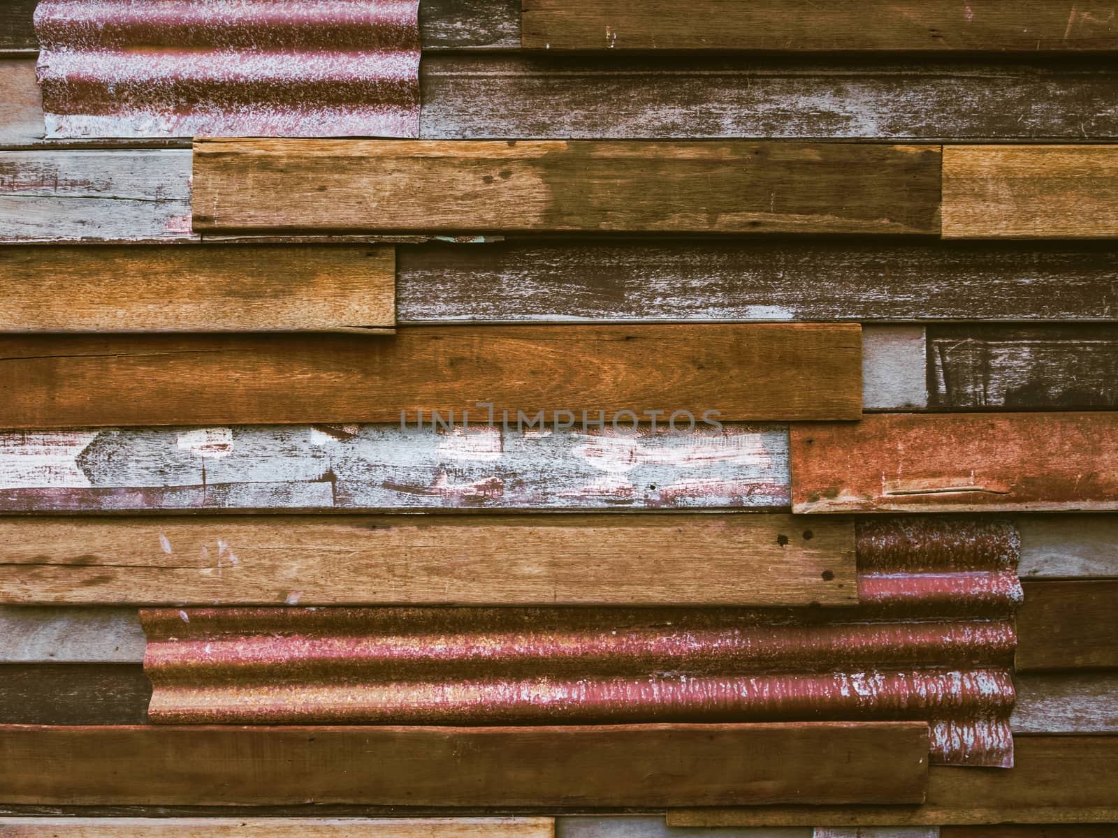 Old wood plank with galvanized iron background.