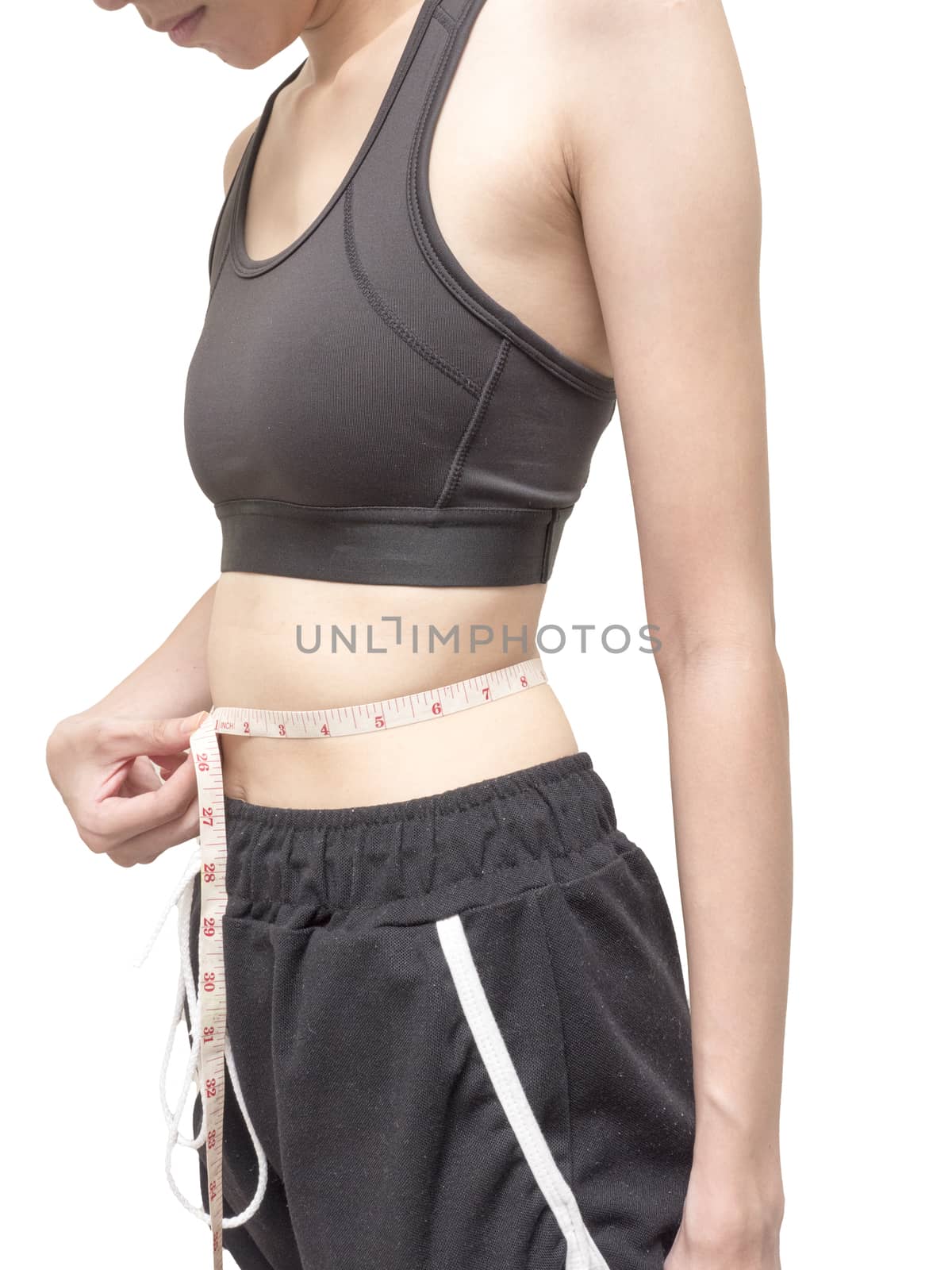 Close up of female body measuring her waist on white background, diet and healthy lifestyle by ronnarong