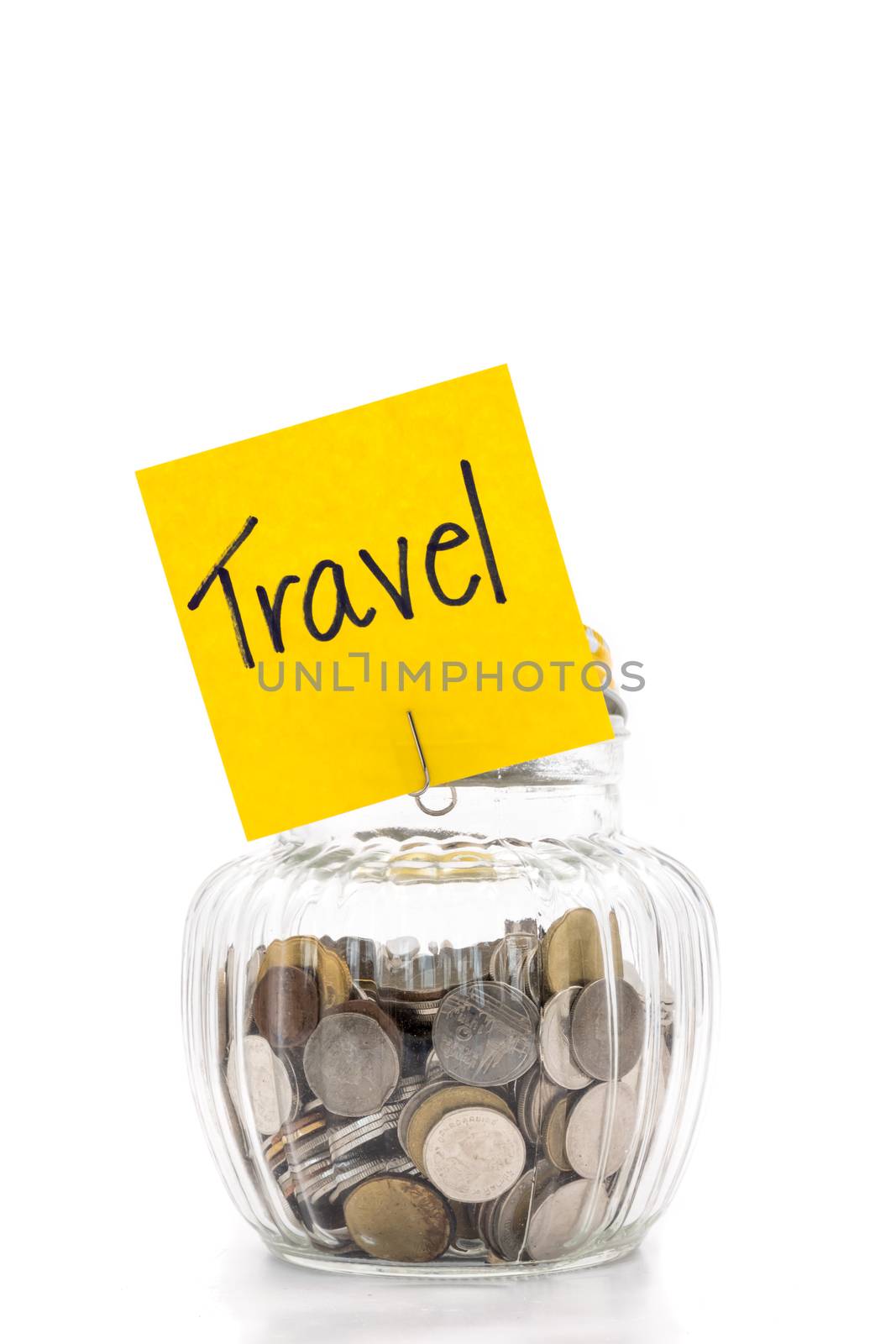 Coins in glass bottle on white background, saving money for Travel