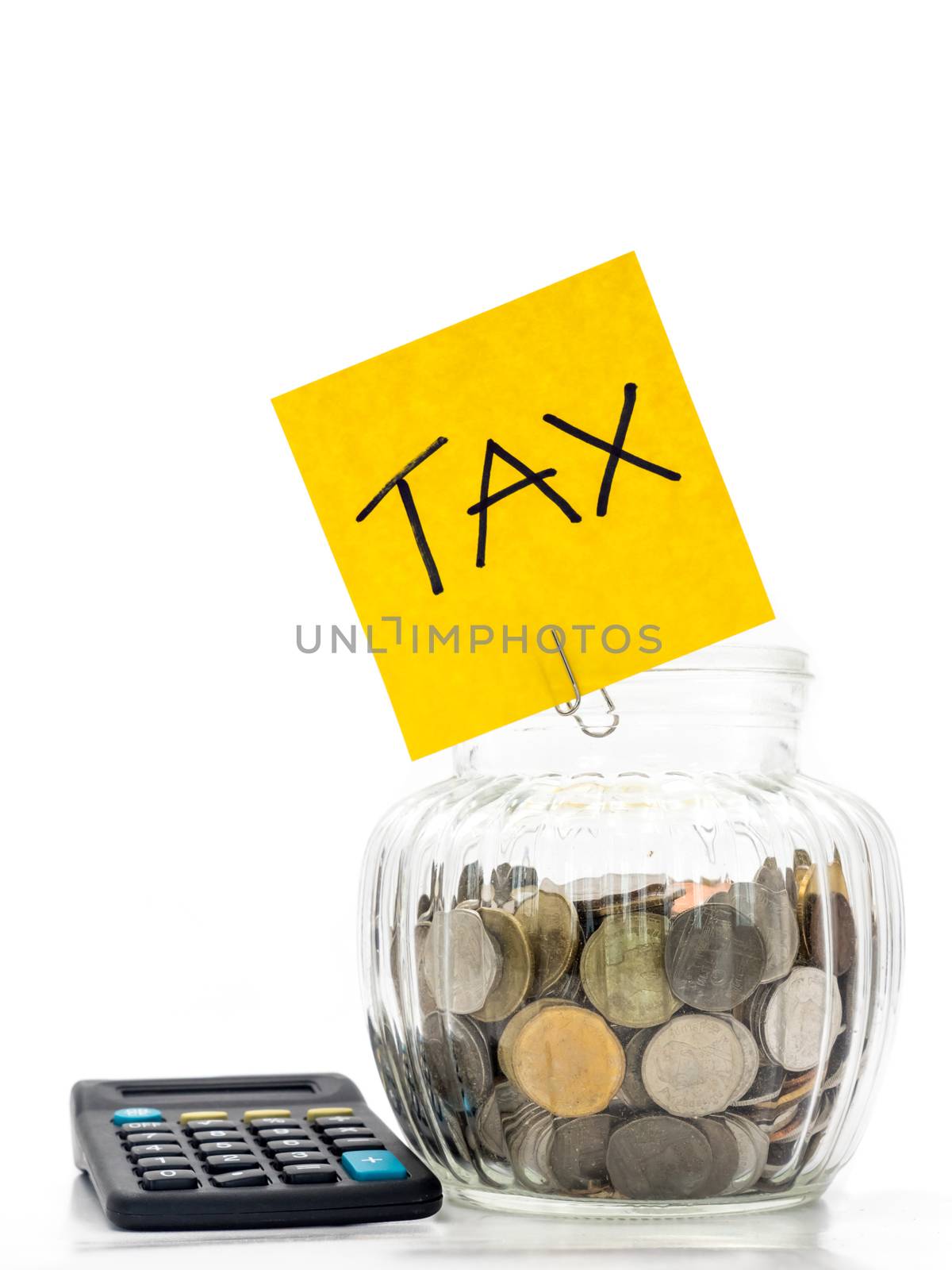 Coins in glass bottle with calculator on white background, saving money for Tax