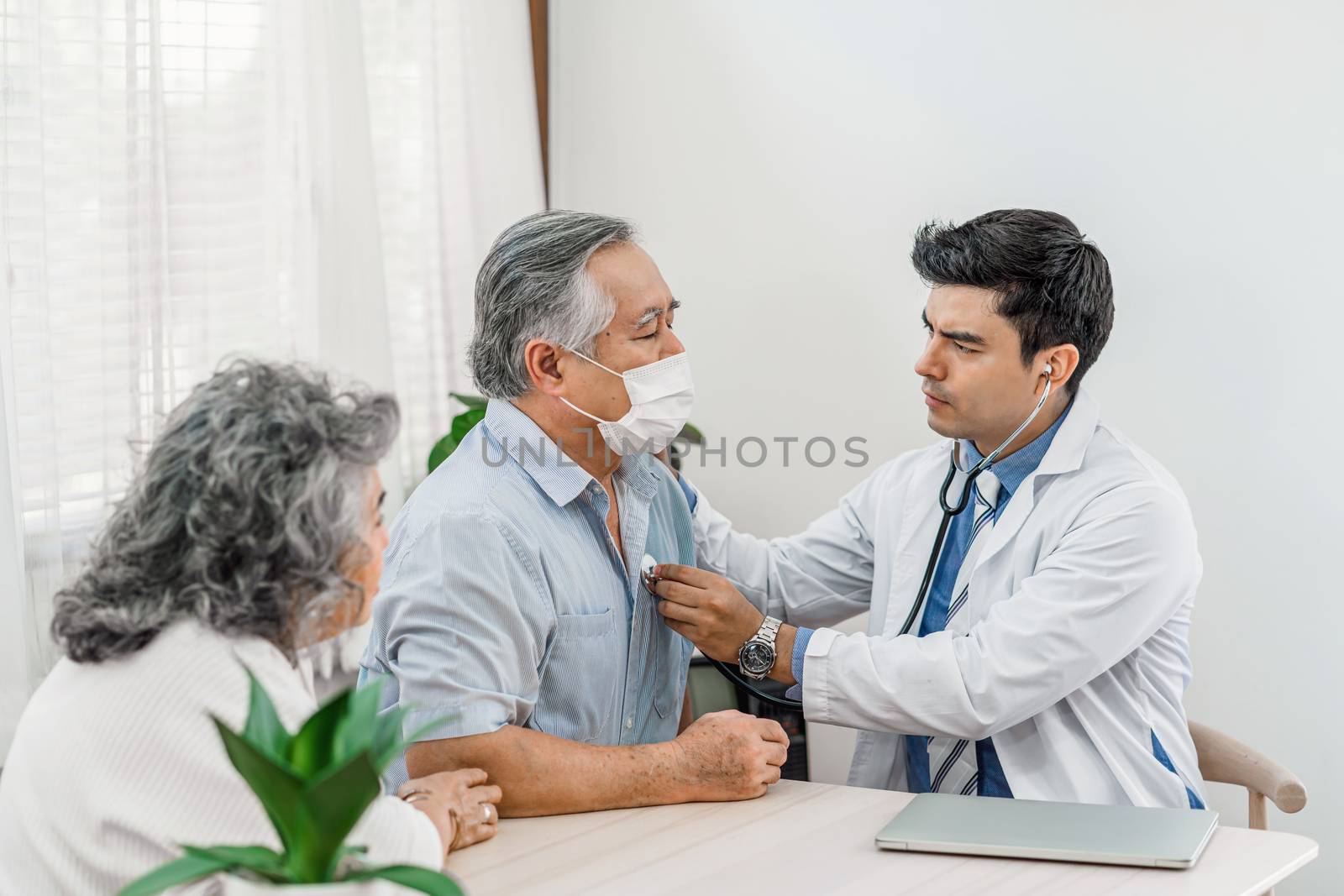 Doctor using stethoscope for auscultate Asian grandparent patient in house, service Life insurance at home, healthcare with Long live and Elderly society, Prevent epidemic concept