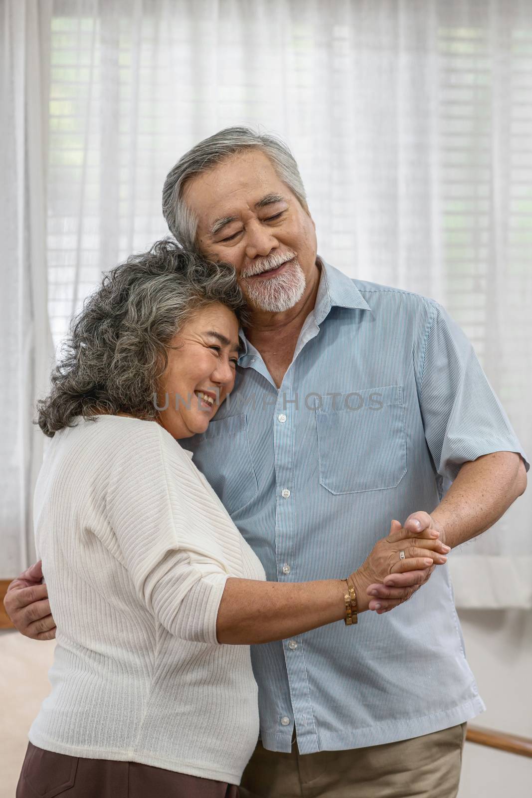 Asian couple Grandparent dancing and hugging together with happy by Tzido