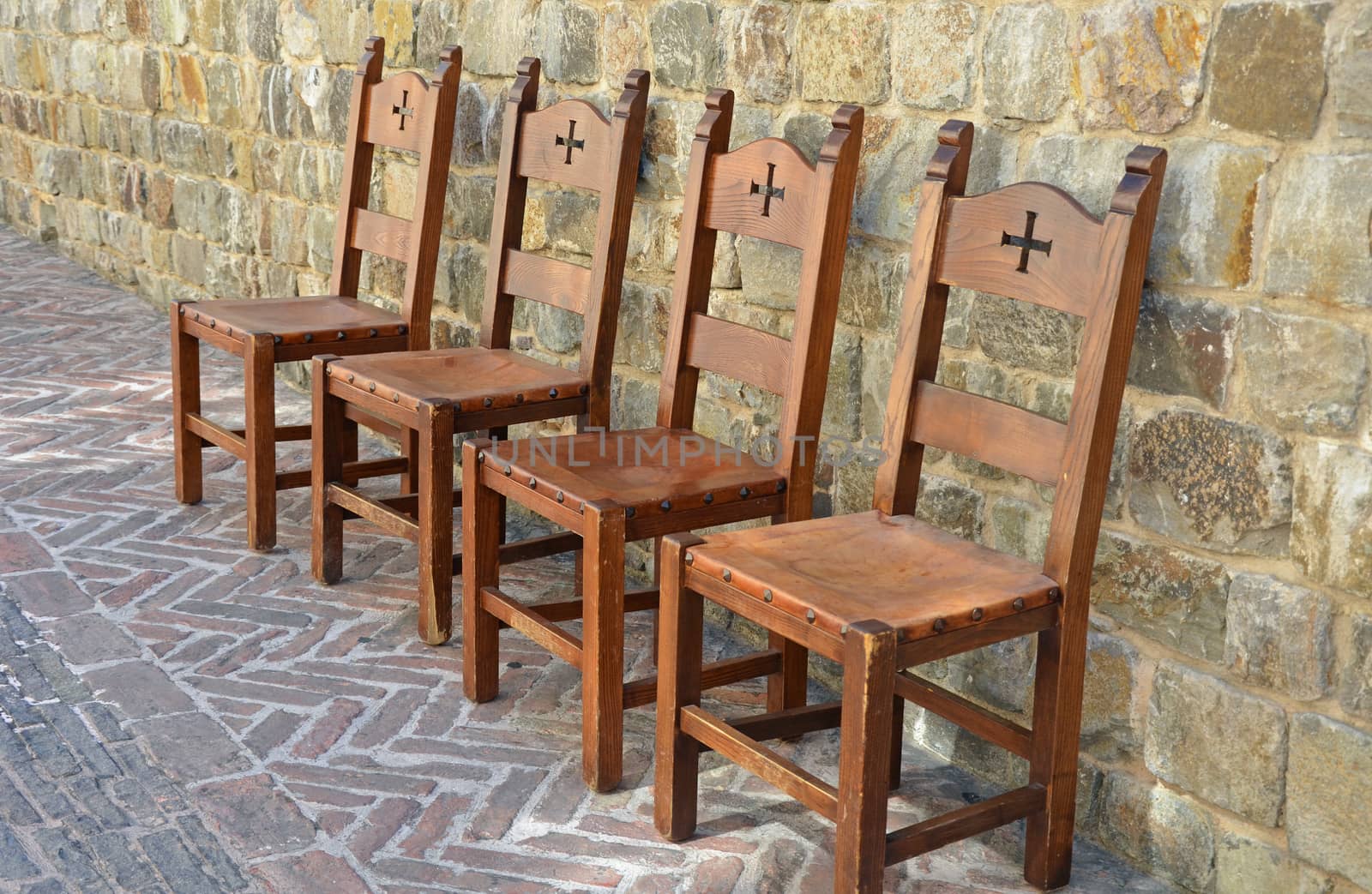 Medieval style chairs on brick patio