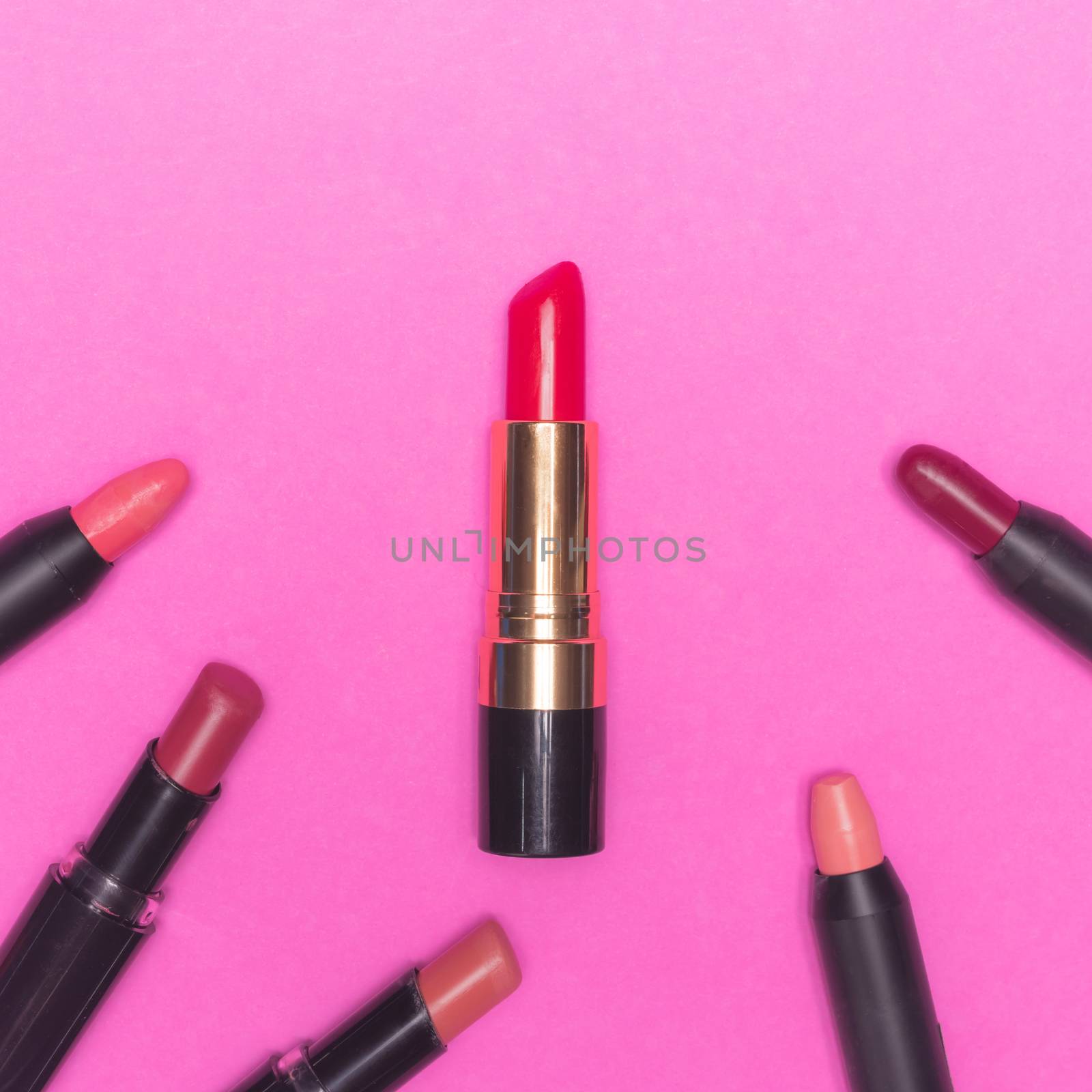 Lipsticks on pink background.  Makeup and Beauty concept