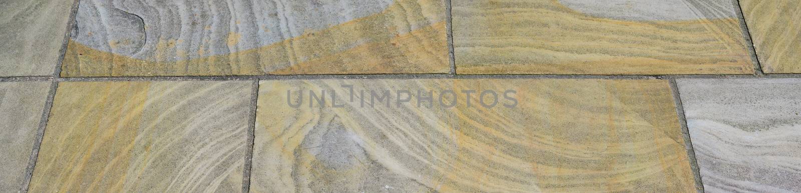 Brown ceramic floor tiles closeup texture in a Panorama