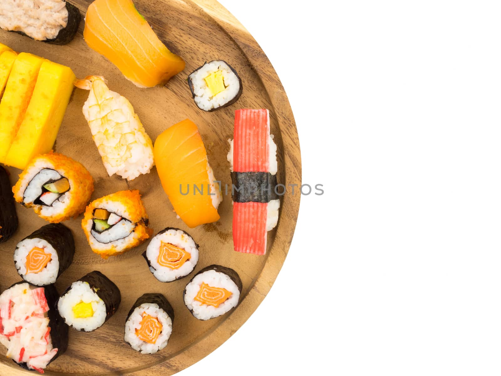 Top view of Sushi set on wooden plate on white background, Japanese food. Free space for text