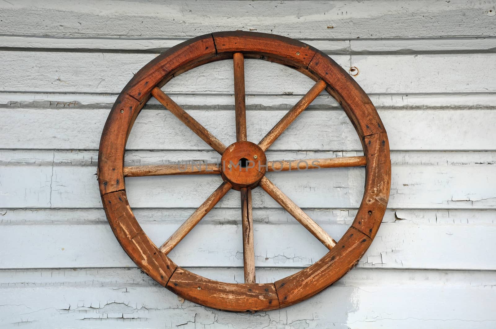 Old weathered wagon wheel by ingperl