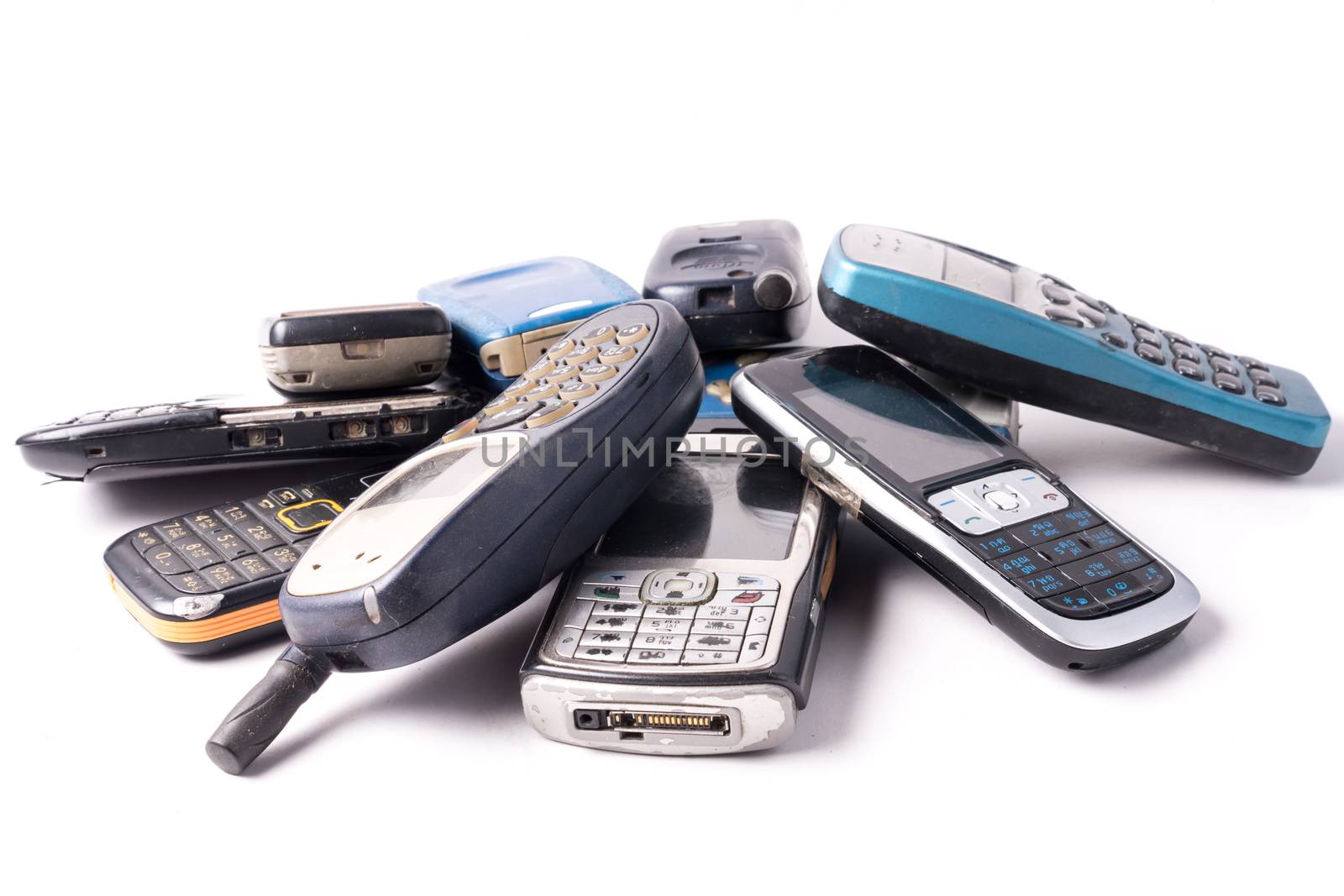 old and obsolete cellphone on a white background.