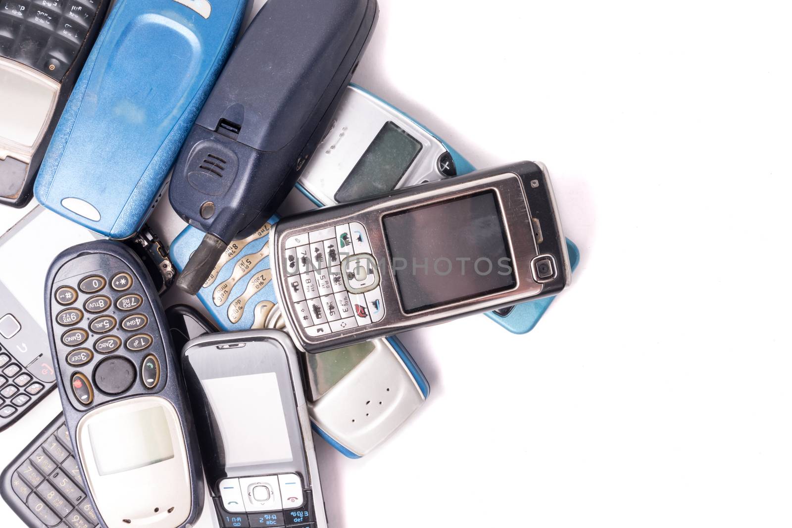old and obsolete cellphone on a white background. Free space for text