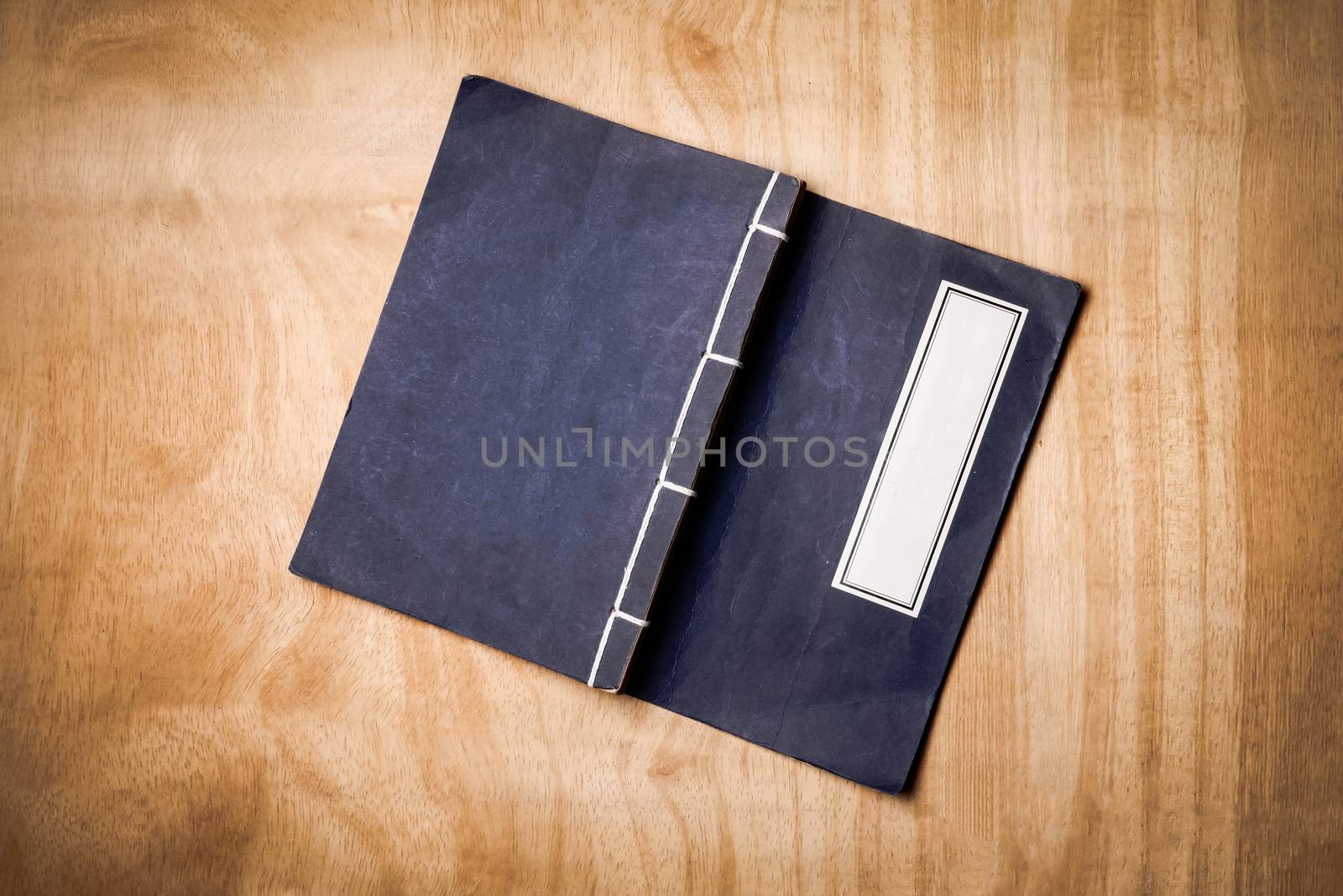 Top view of a book wooden table background.