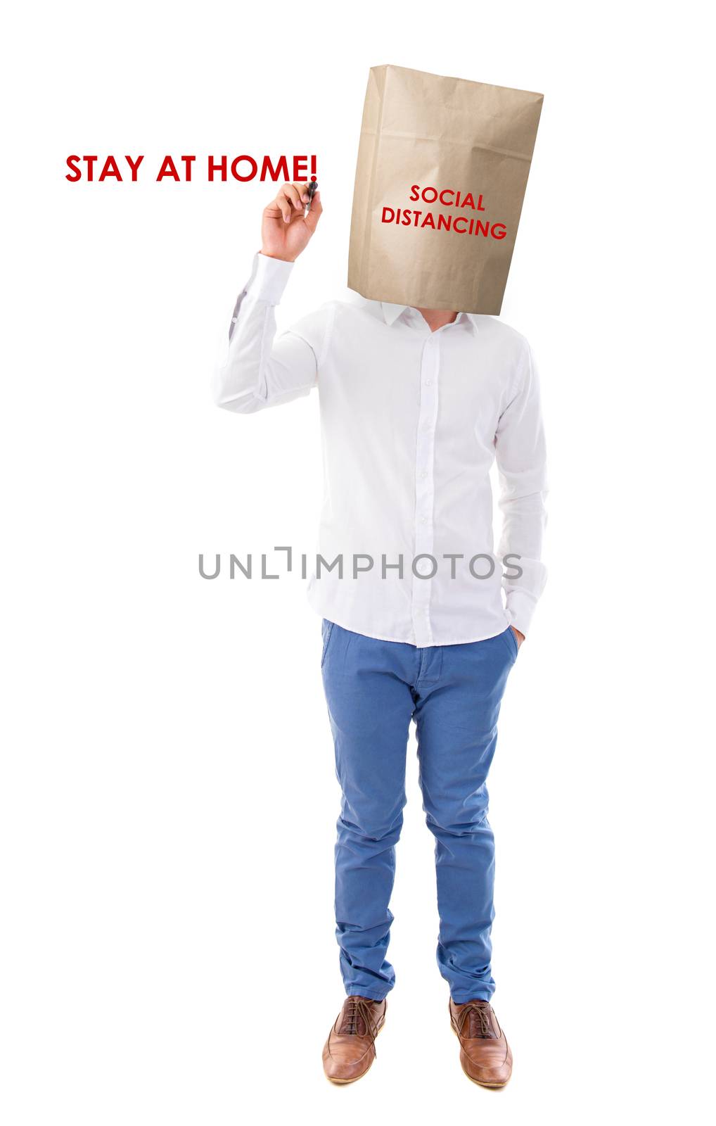Social distancing to avoid the spread of coronavirus. Man covered head with paper bag.