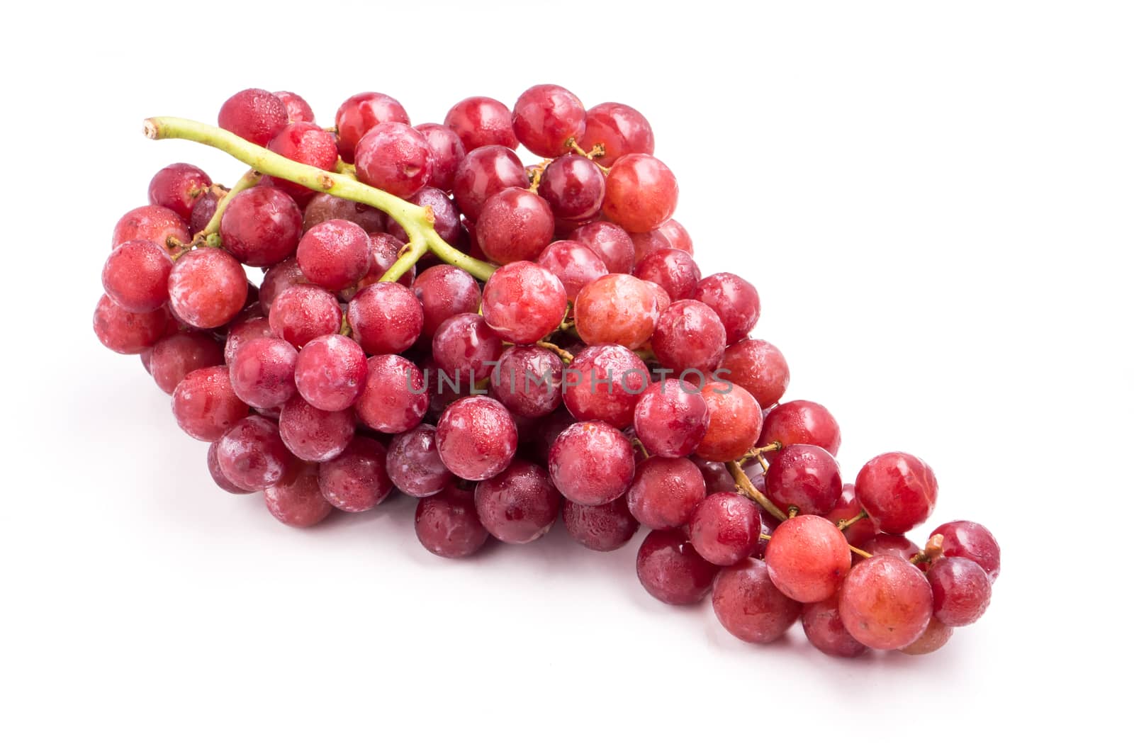Red grapes on a white background.