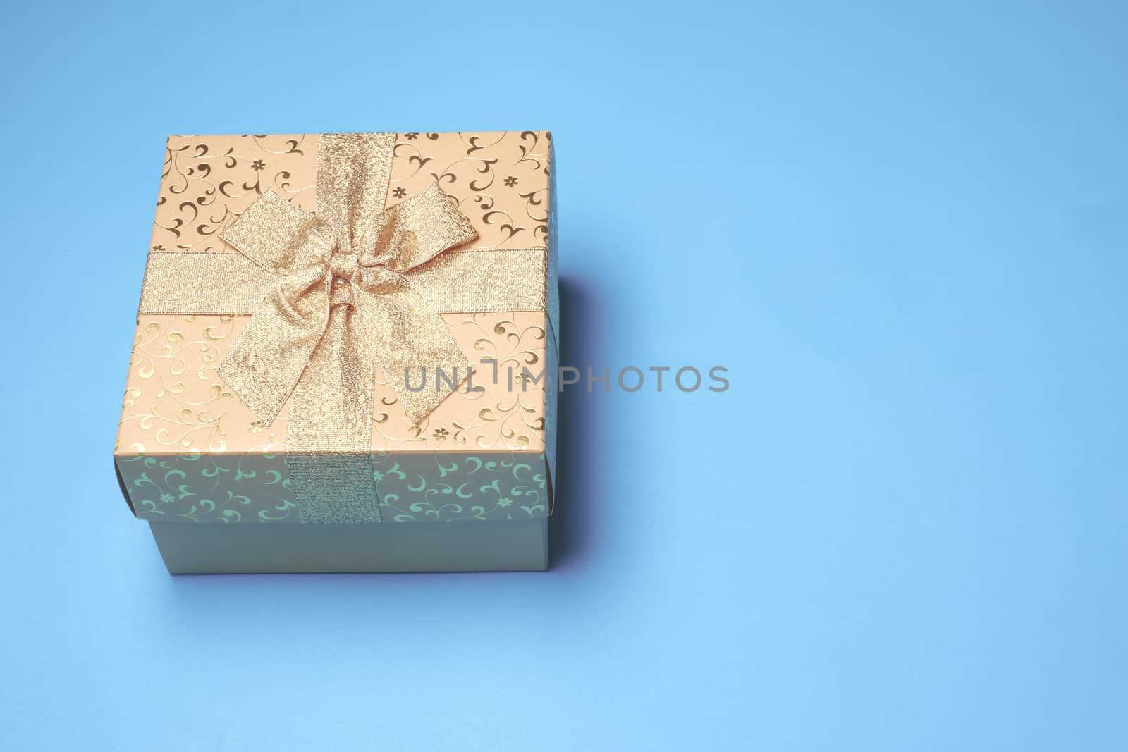 Top view of gift box on blue background. Free space for text