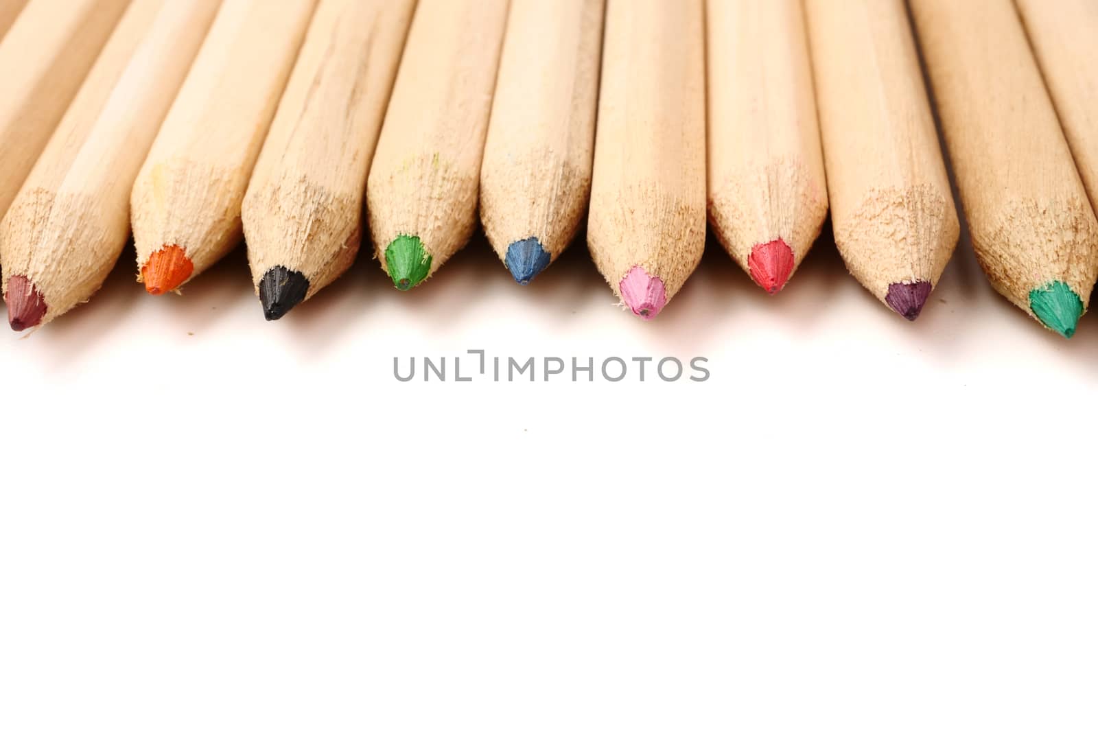 Color pencils on white background. Free space for text