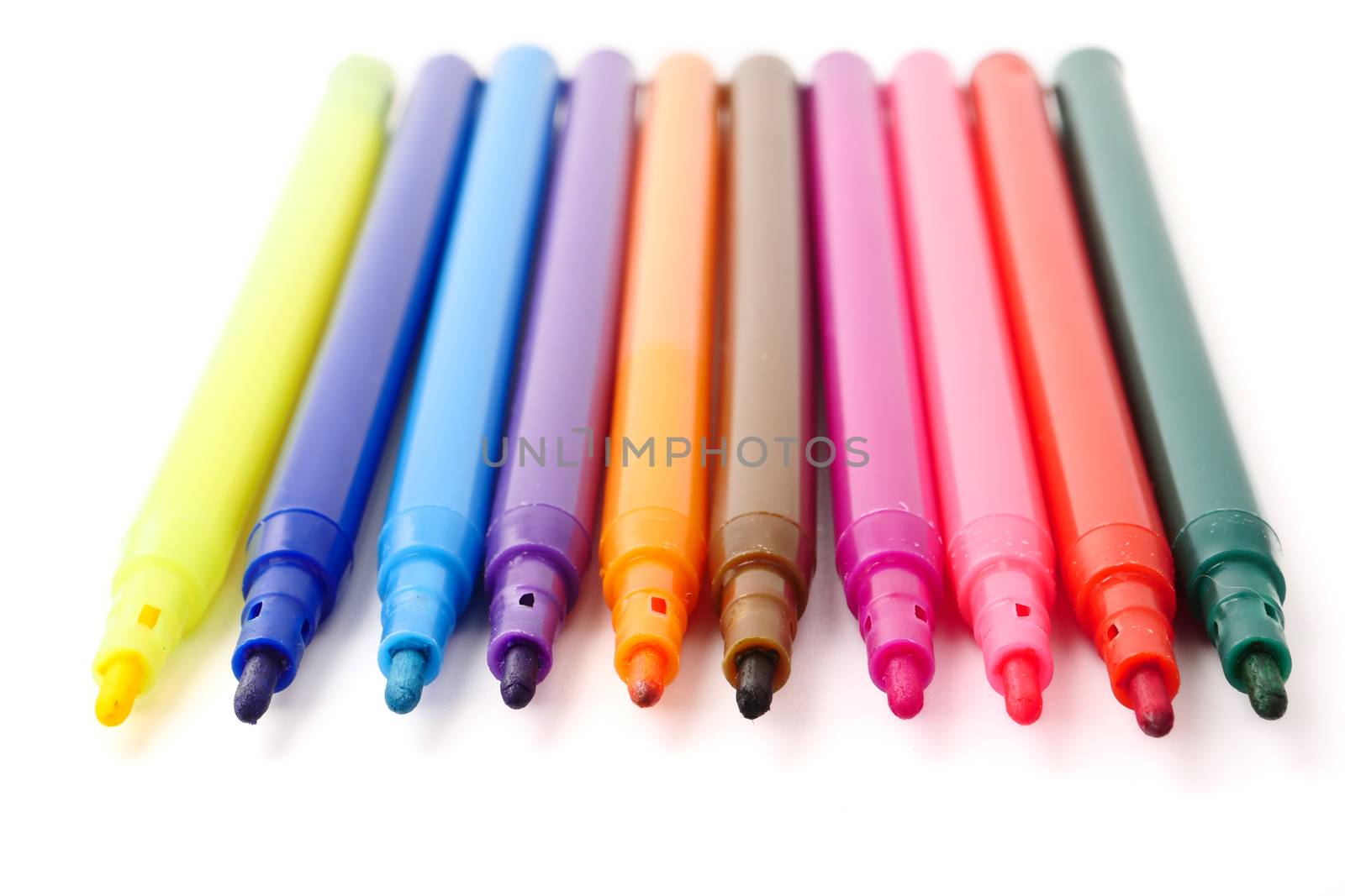Magic colorful pens on a white background.