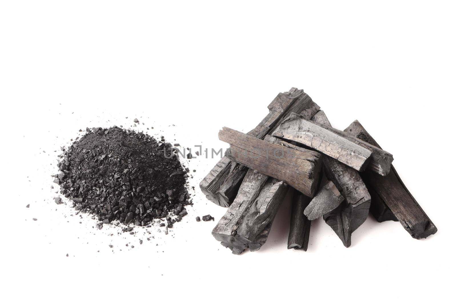 Charcoal and powder (activated carbon) on white background.