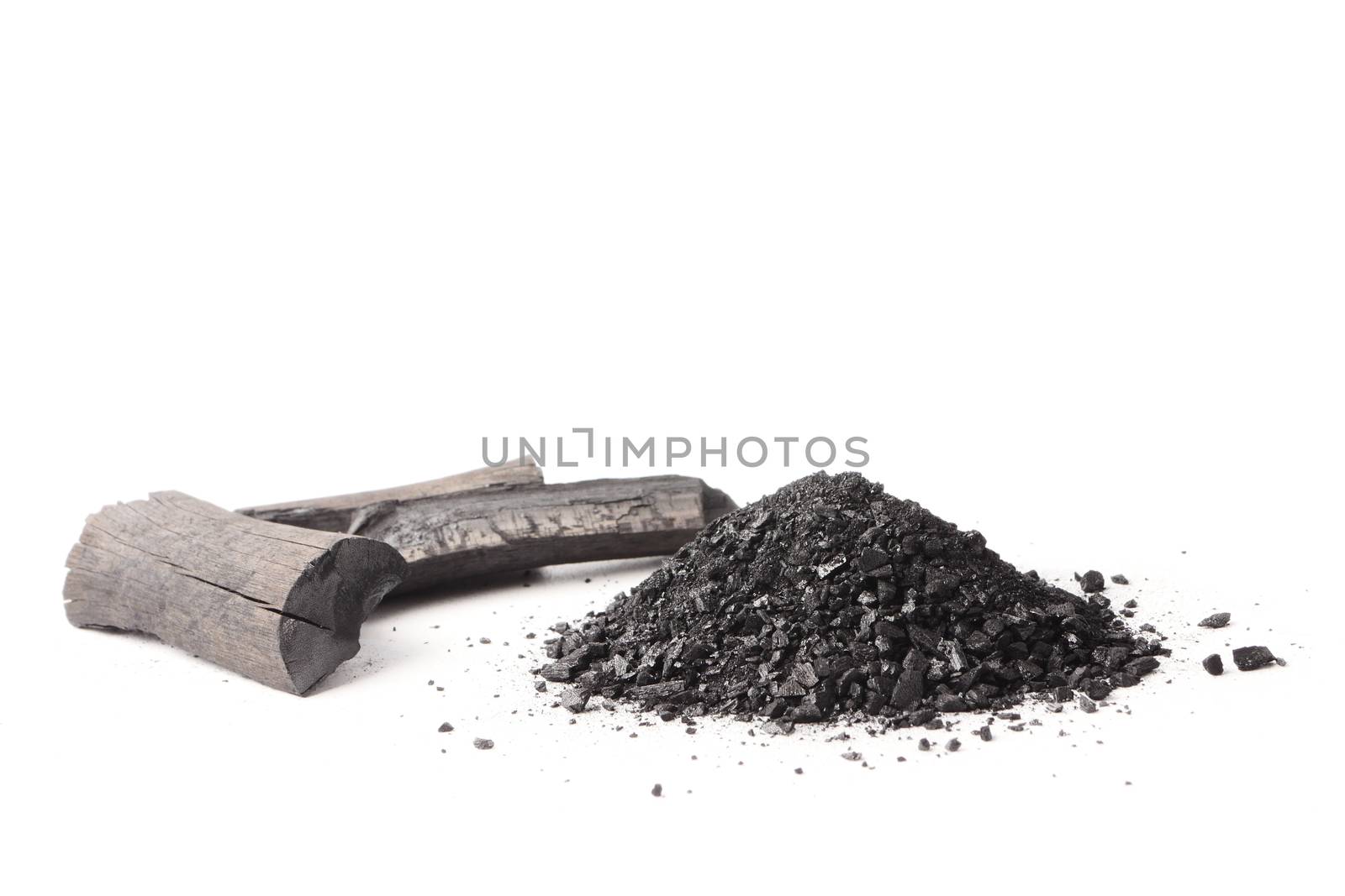 Charcoal and powder (activated carbon) on white background.