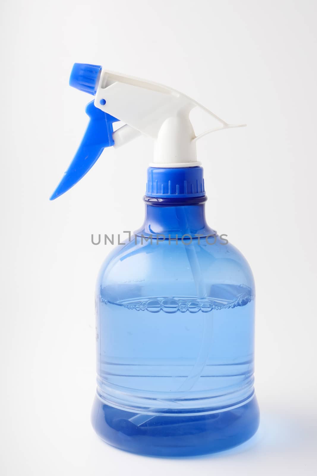 Spray bottle on a white background. Splashing water.