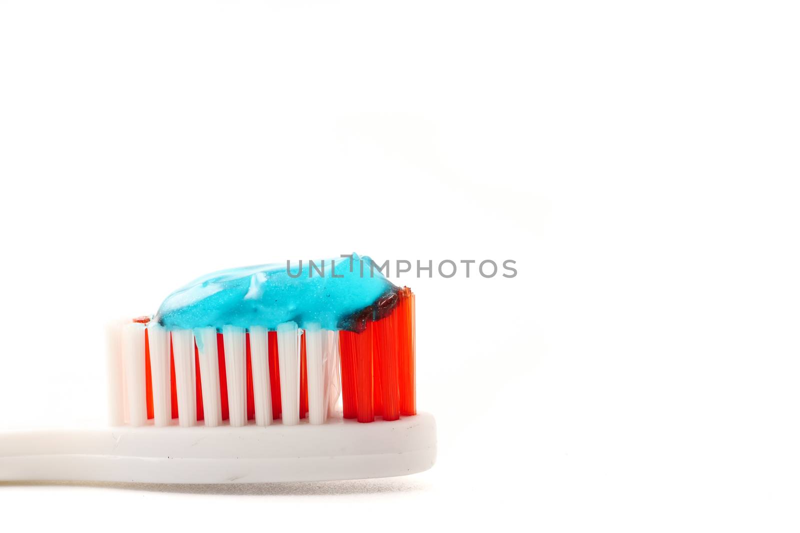 Close up of Toothbrush with toothpaste on a white background. by ronnarong