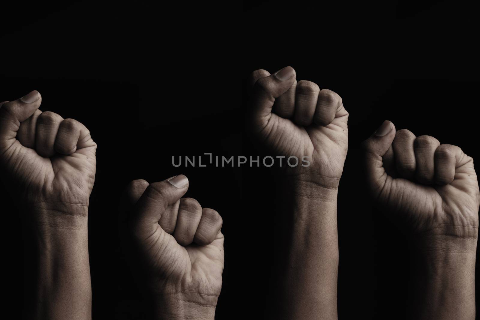 Concept against racism or racial discrimination by showing with hand gestures fist or solidarity by lakshmiprasad.maski@gmai.com