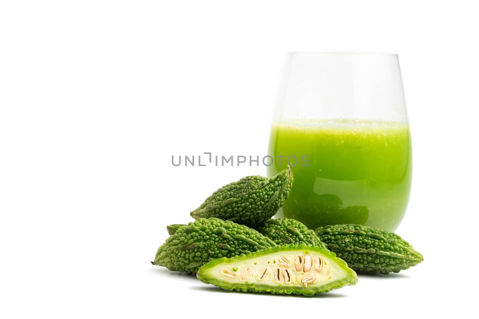 Herbal juice with bitter melon or bitter gourd on white background. free space for text