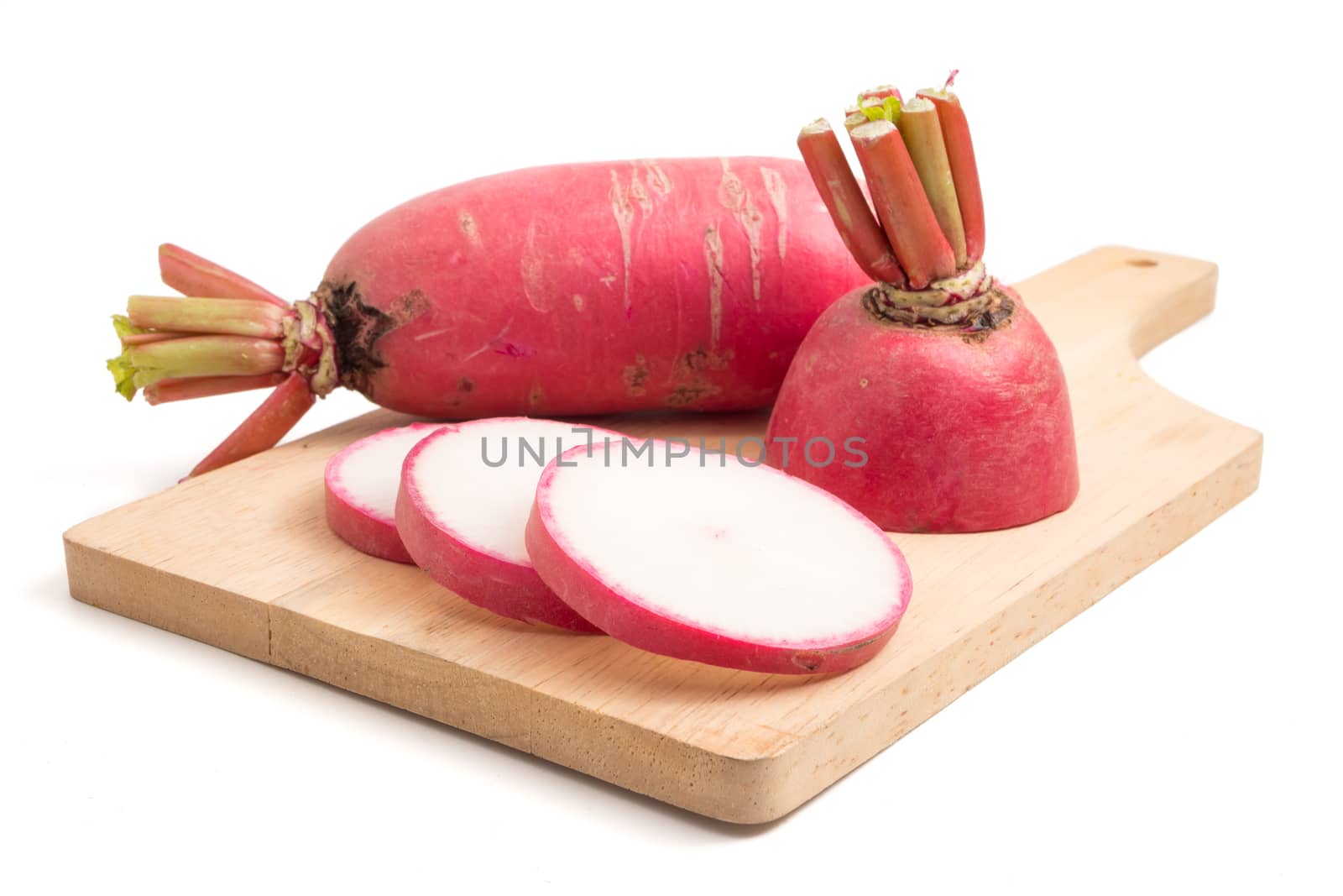 Fresh Pink Radishes on wooden tray over white background.