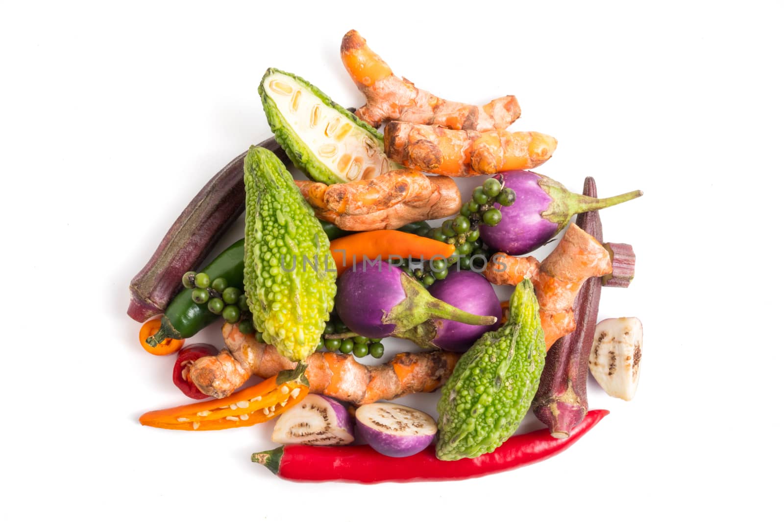 Group of fresh vegetables and herbs on white background.