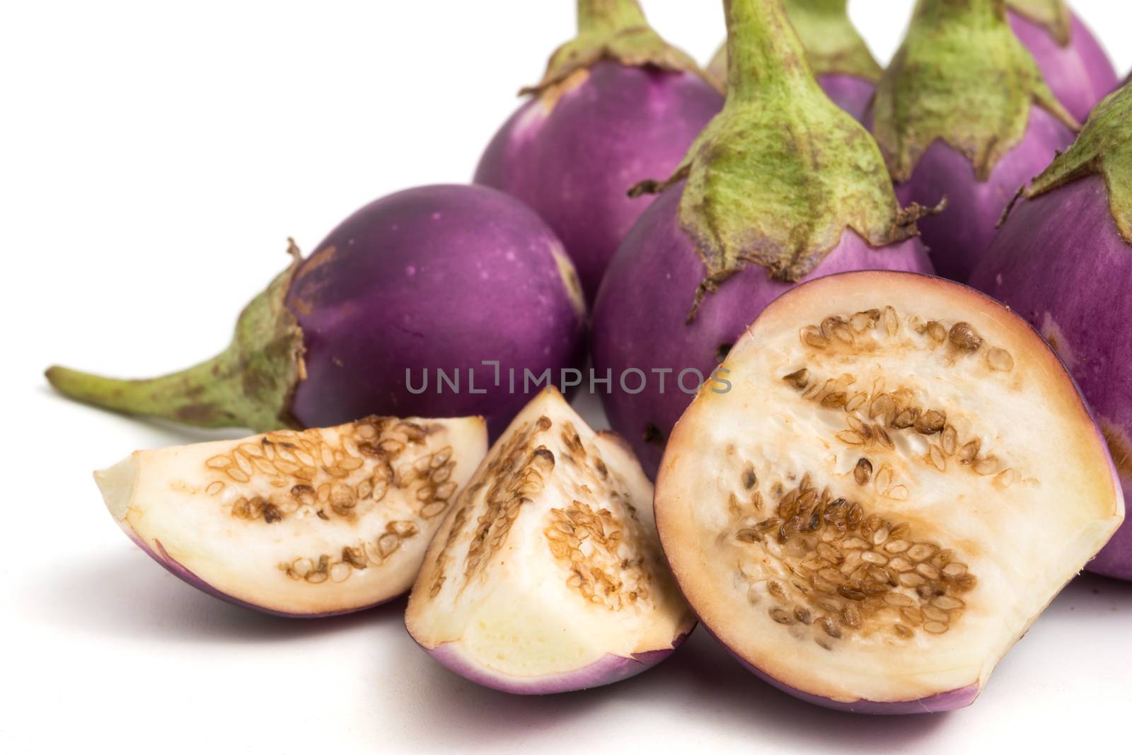 Fresh Purple eggplants on white background. by ronnarong