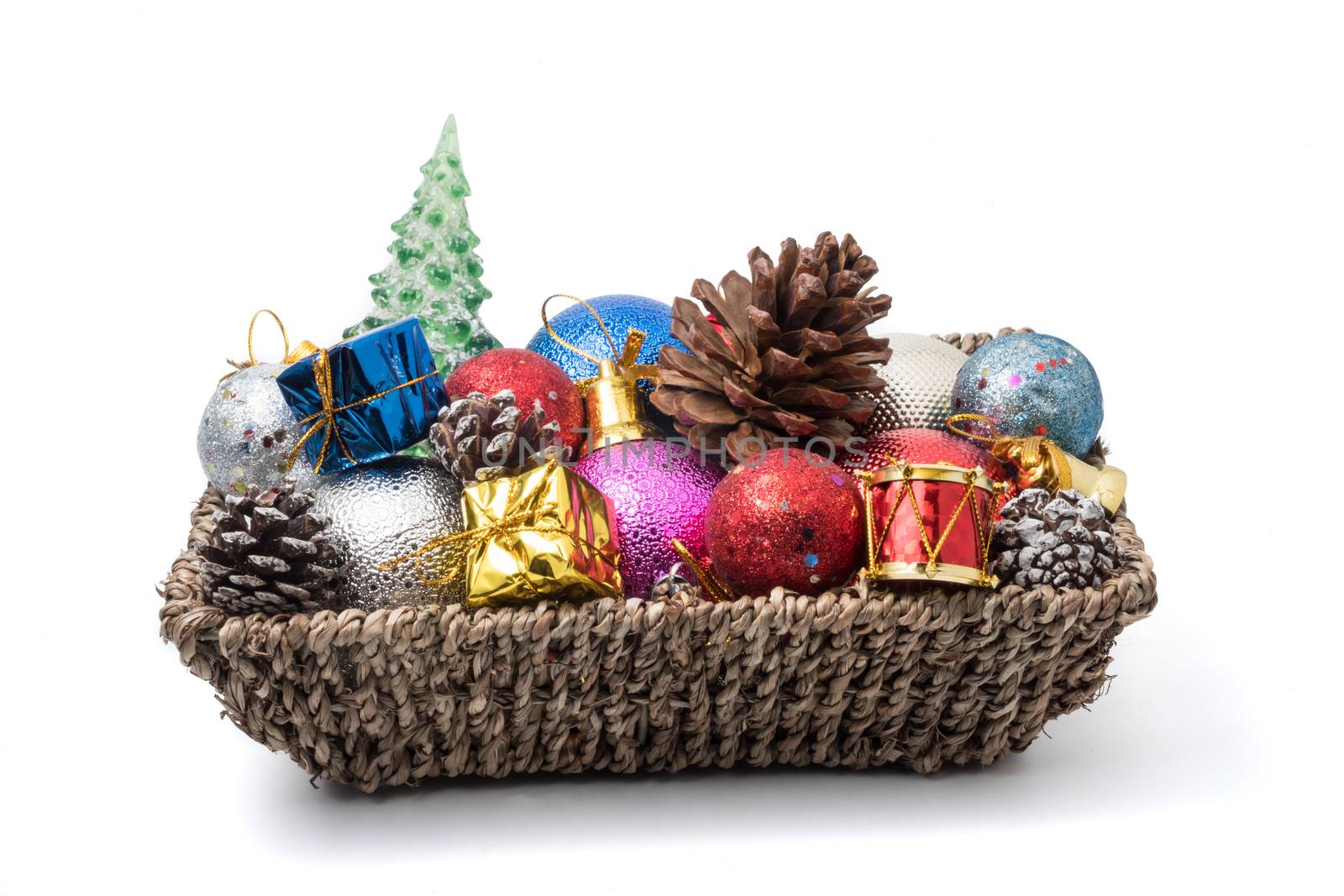 Christmas decoration in basket on white background.