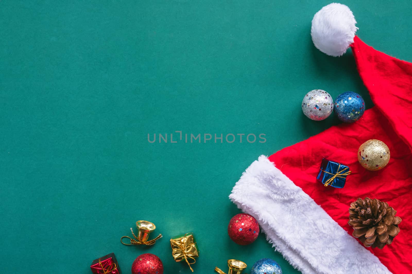 Top view of christmas decoration on green background. Free space for text