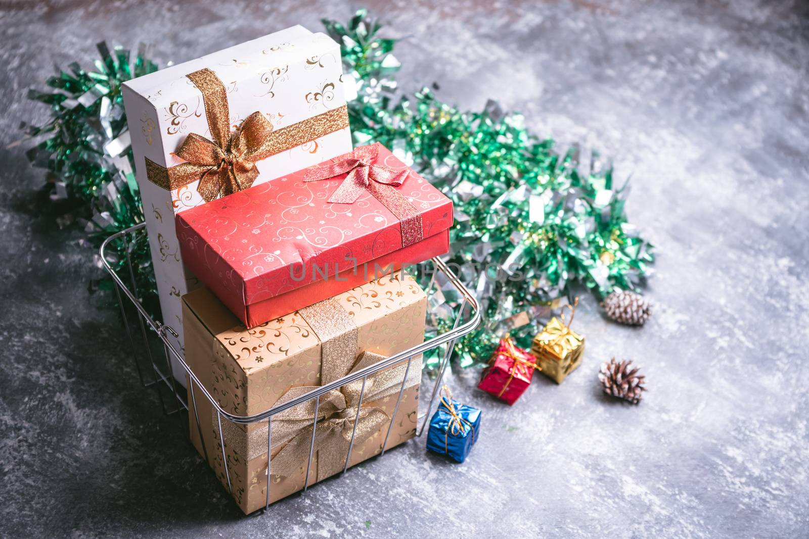 Gift boxes and Christmas decoration on gray grunge background by ronnarong