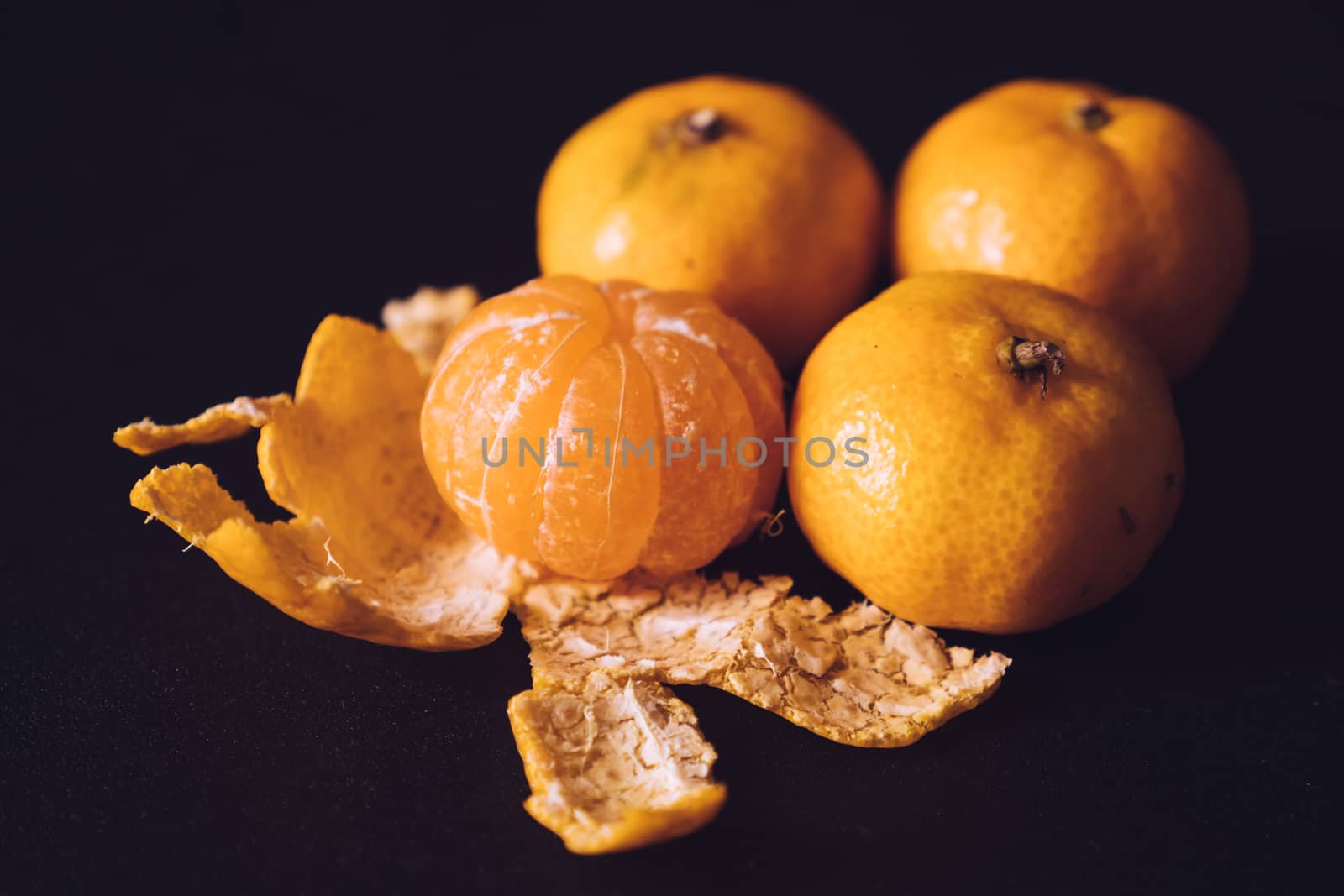 Close up of Fresh tangerines, Orange fruits on dark background.