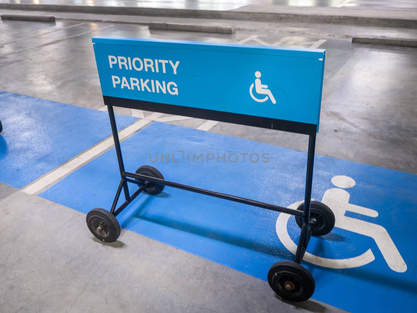 The international sign for a handicapped parking stall in a park by shutterbird