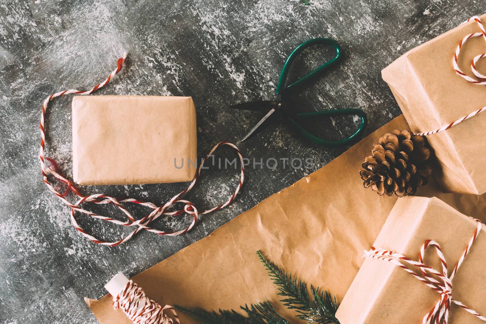 Preparation christmas gifts on gray grunge background.
