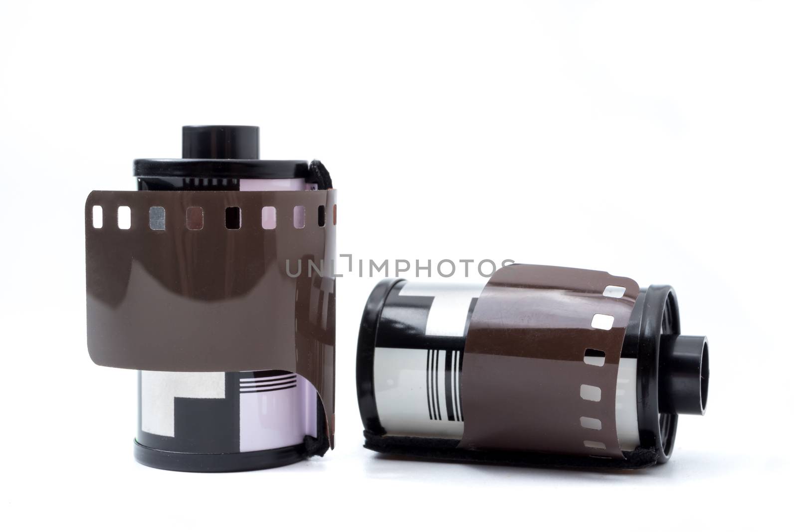 Photo film in cartridge, Photographic roll film 35 mm on a white background.
