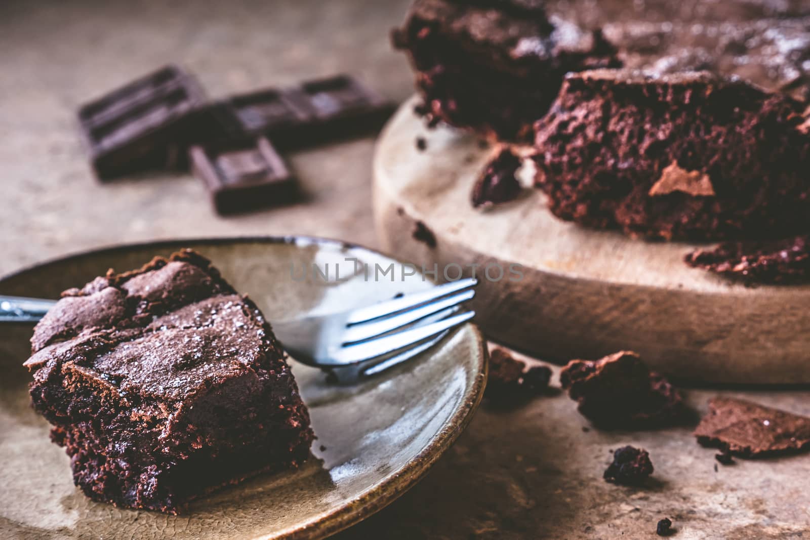 Close up of Chocolate cake on dish with fork.