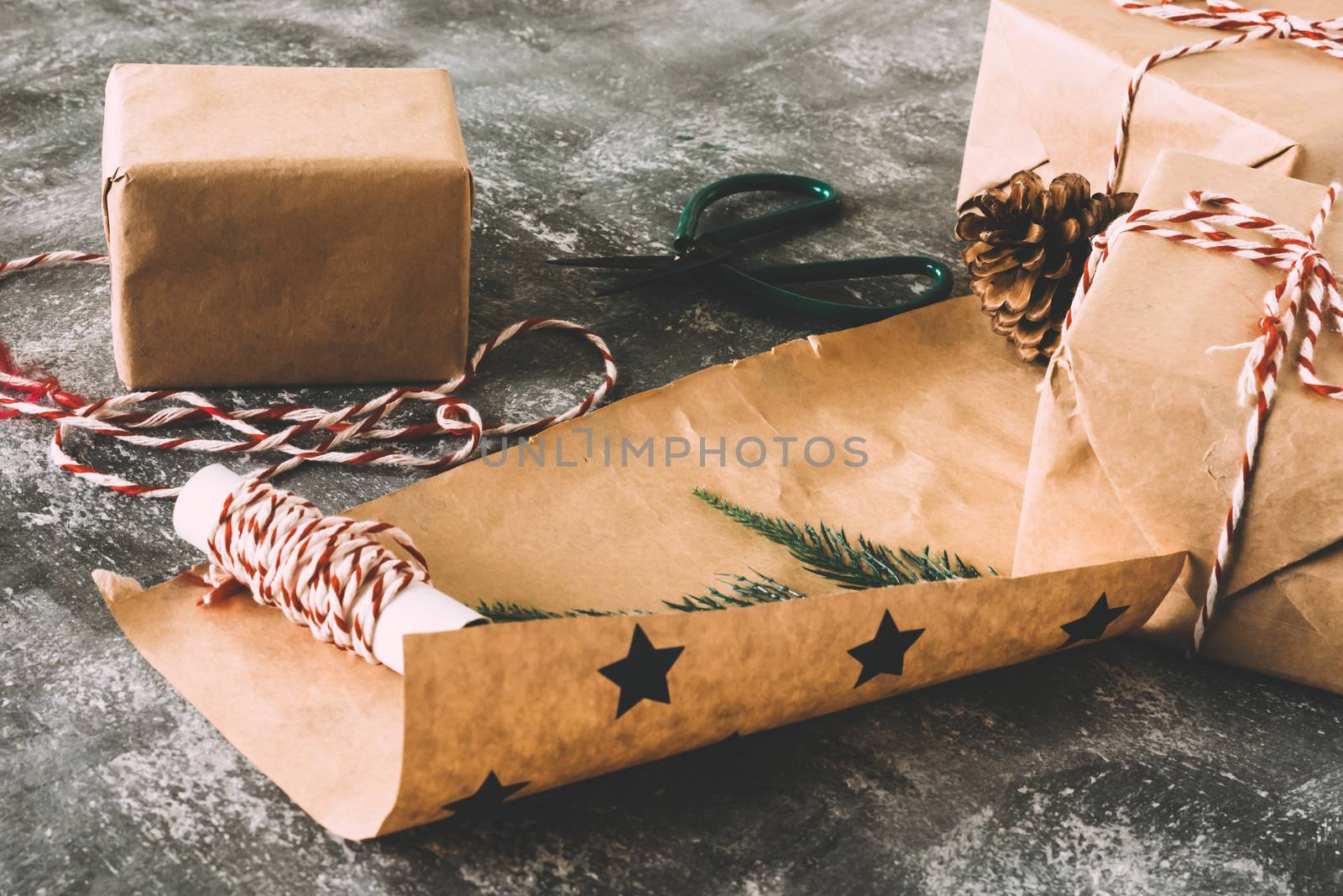 Preparation christmas gifts on gray grunge background. by ronnarong
