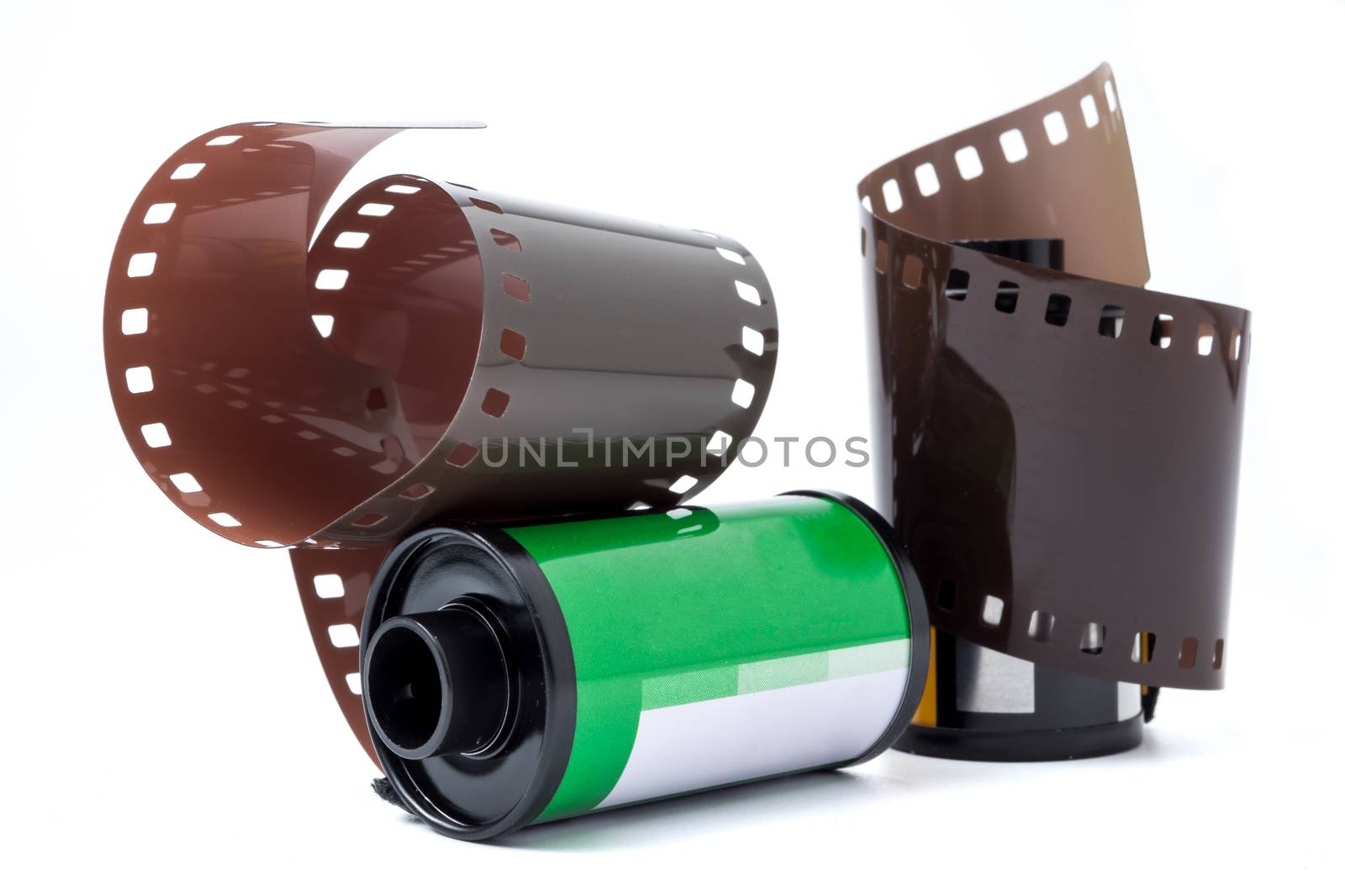 Photo film in cartridge, Photographic roll film 35 mm on a white background by ronnarong