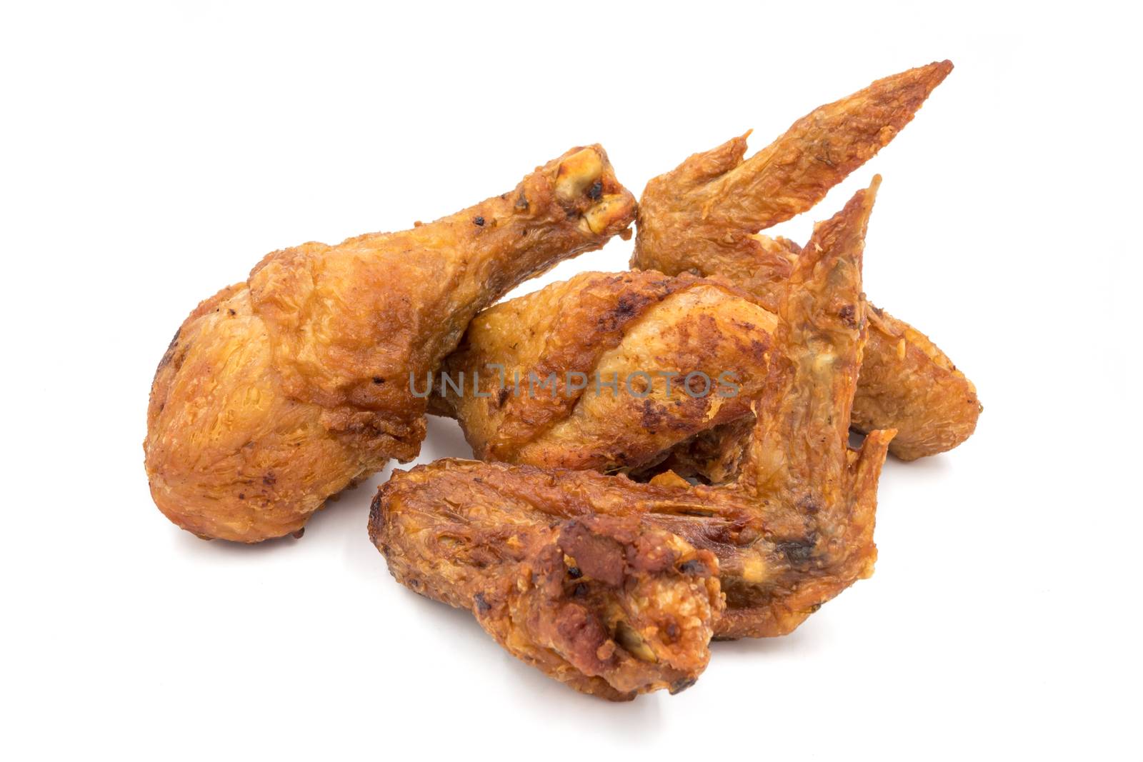 Fried chicken legs and wings on a white background. by ronnarong