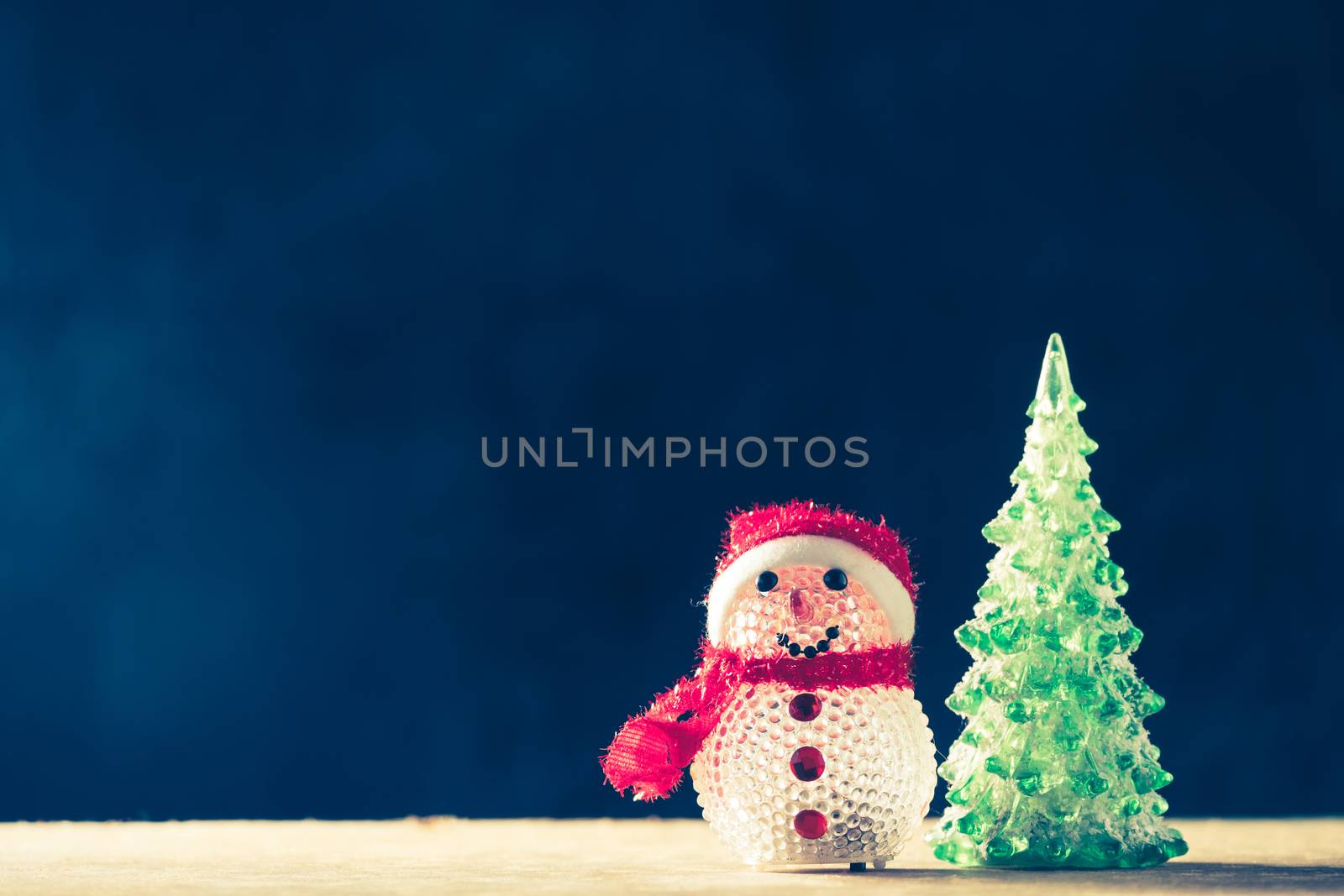 Christmas decorations on the wooden table, black background, free space for text, vintage tone