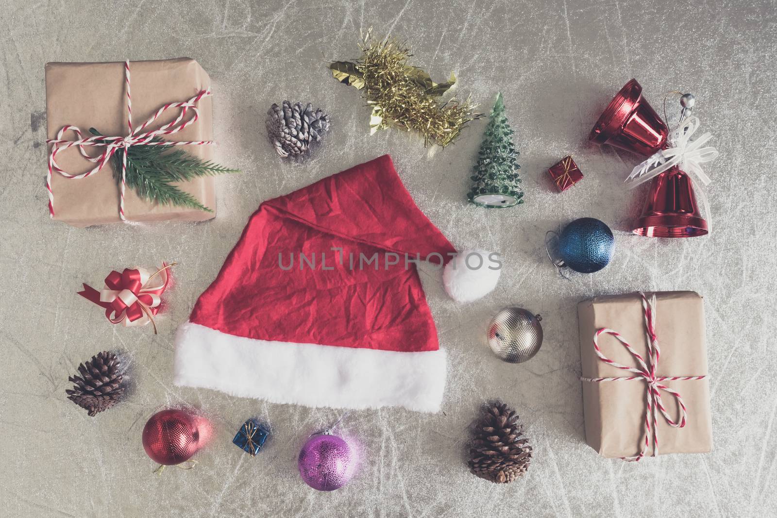 Top view of Christmas decorations on silver background.