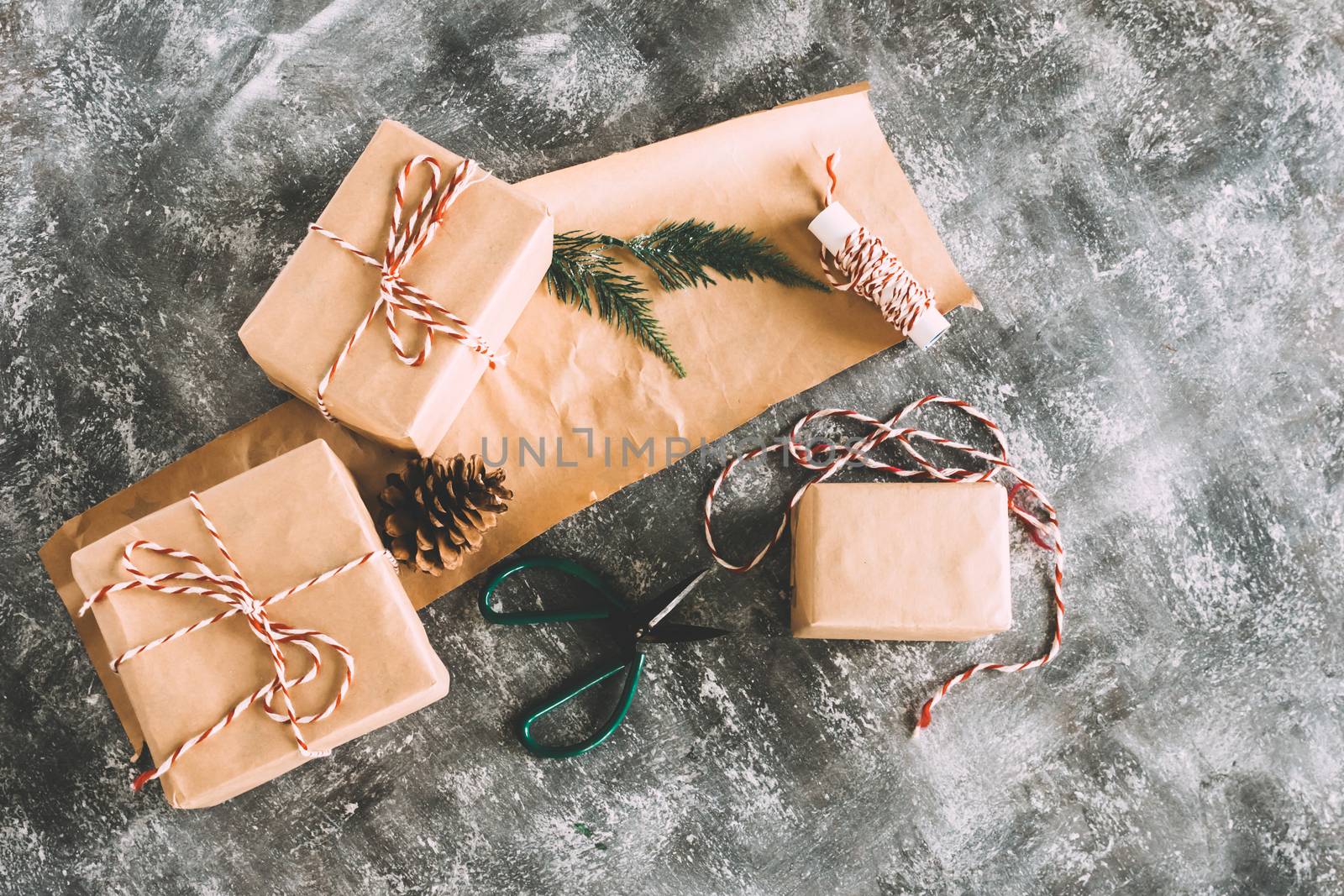 Preparation christmas gifts on gray grunge background. by ronnarong