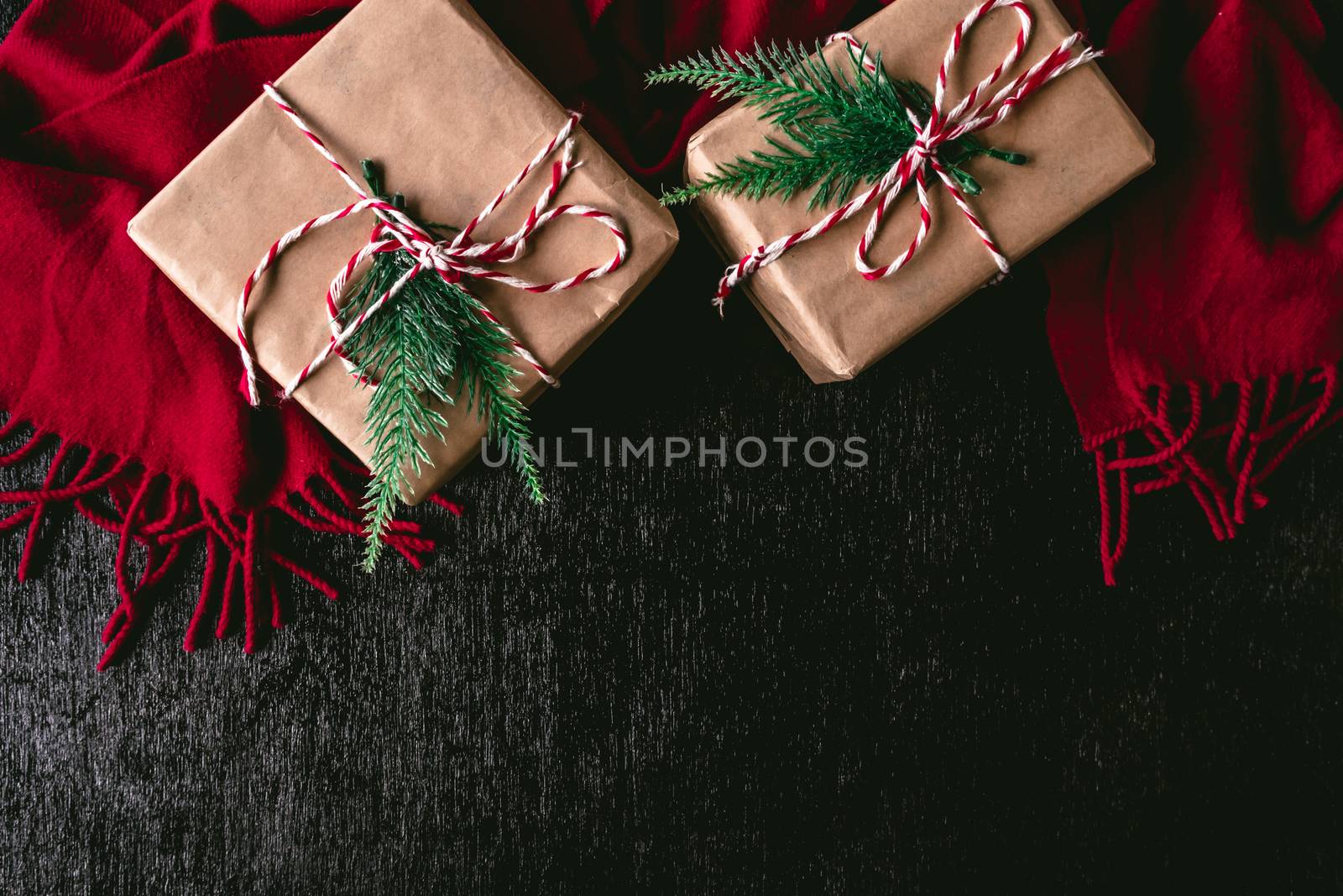 Top view of Gift packages wrapped in brown paper and red scarf o by ronnarong