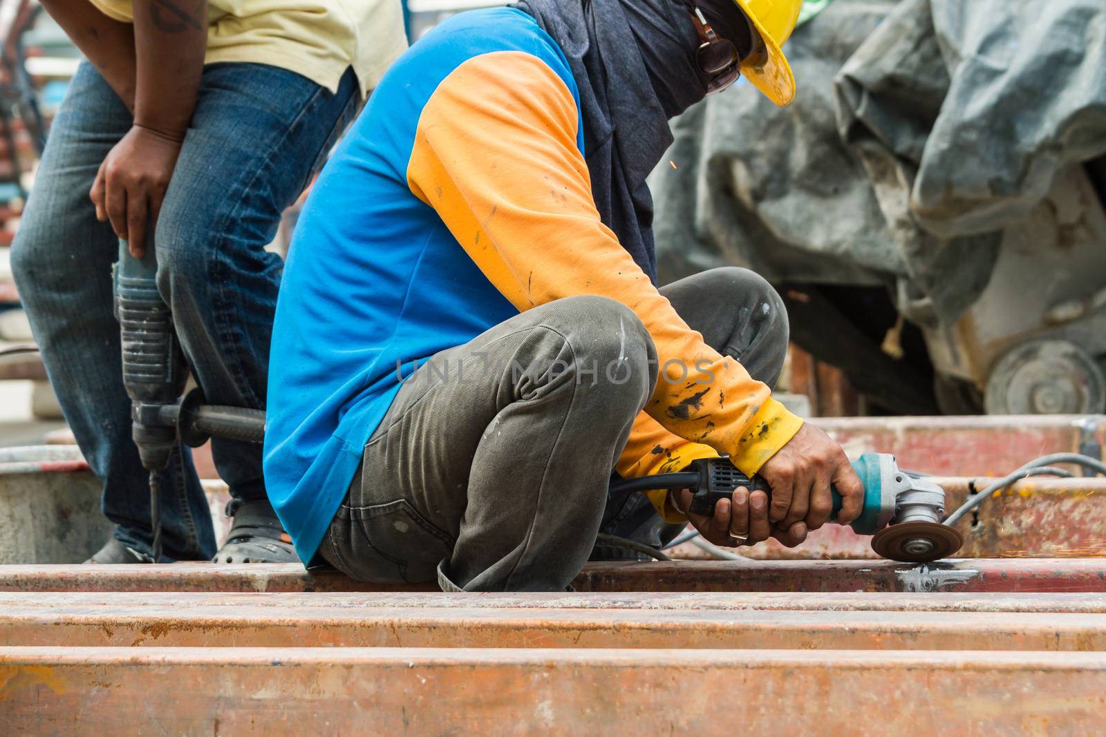 Steel Workers welding, grinding, cutting in metal industry